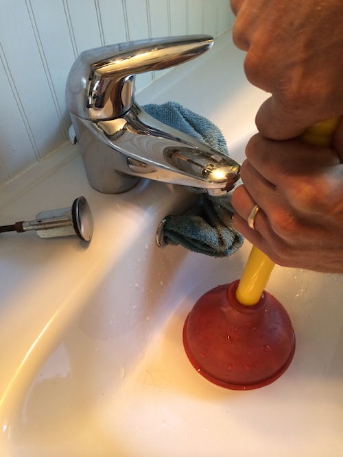 Proper sink plunging technique: Remove stopper, plug vent hole with rag, plunge.