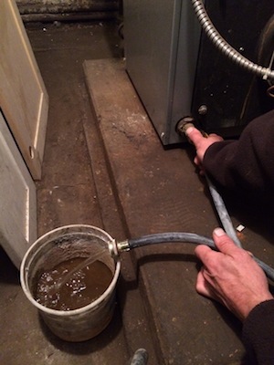 HM drains many buckets of rusty water.