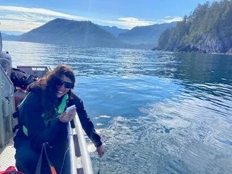 Shauna checks sea surface temperature as a part of bird transect monitoring.