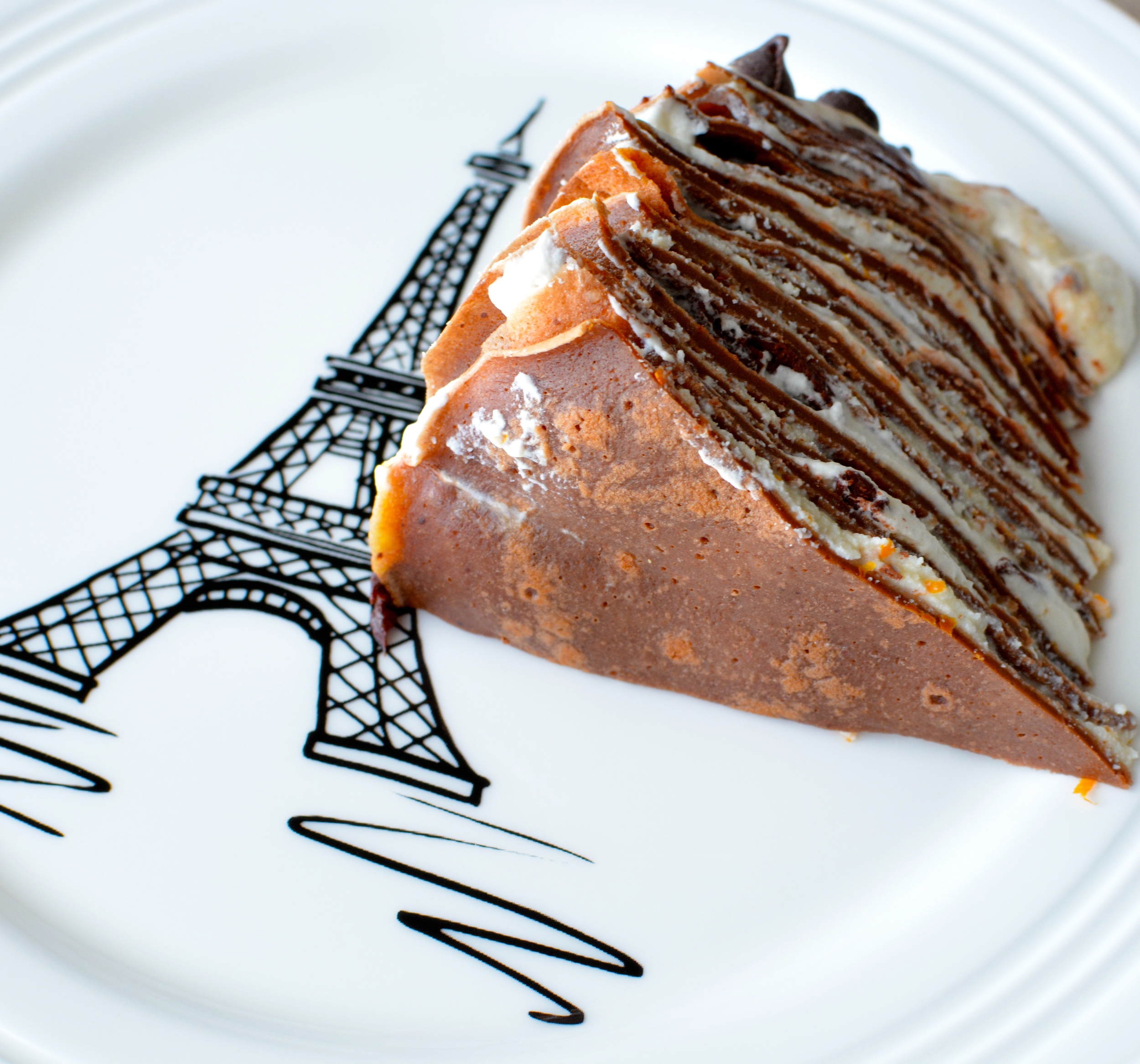 Chocolate Cannoli Crepe Cake with Vanilla Whipped Cream, Orange Cream Sauce and Chocolate Ganache