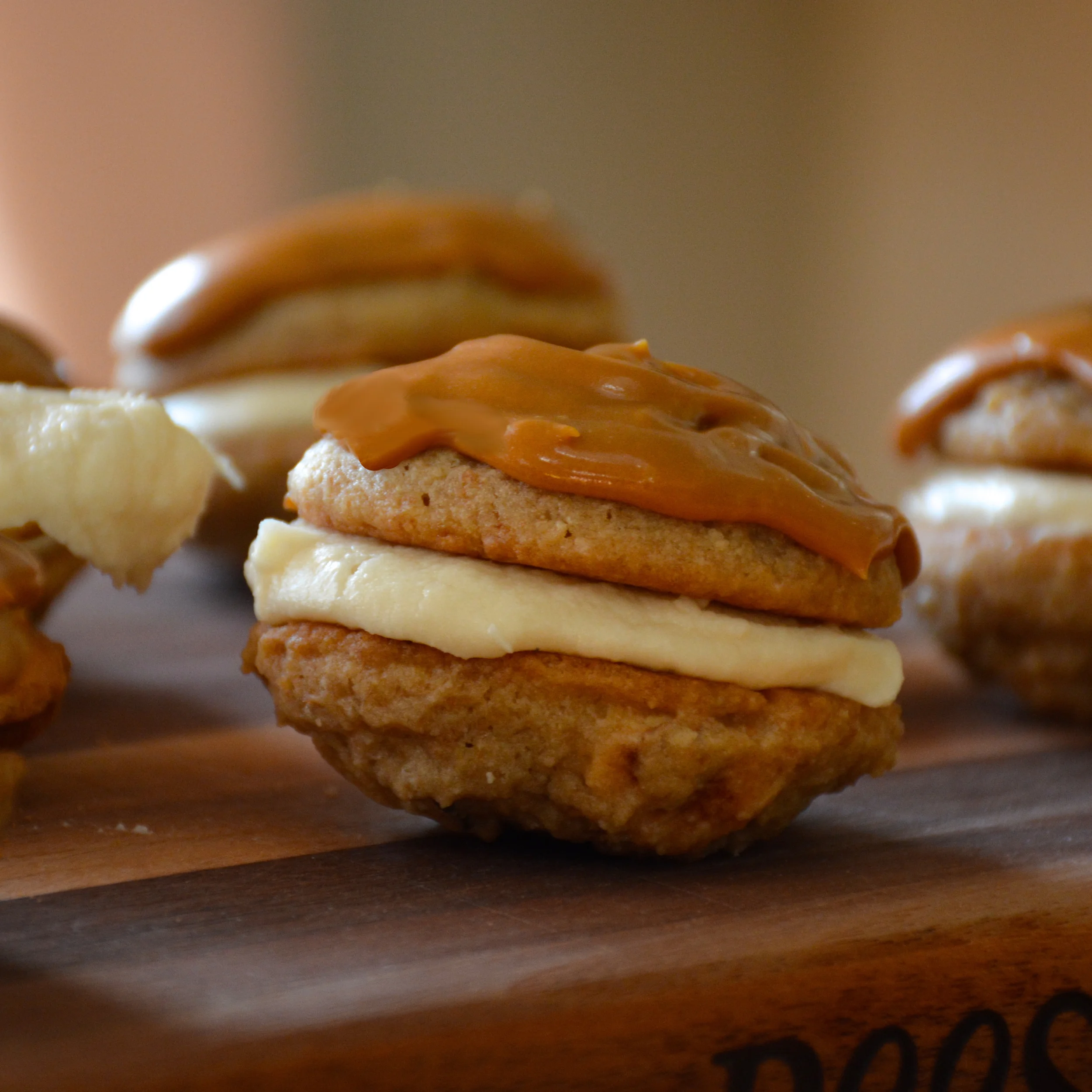 Banoffee Inspired Cookies - Banana Cookies with Vanilla Banana Cream Filling and Dulce de Leche Frosting