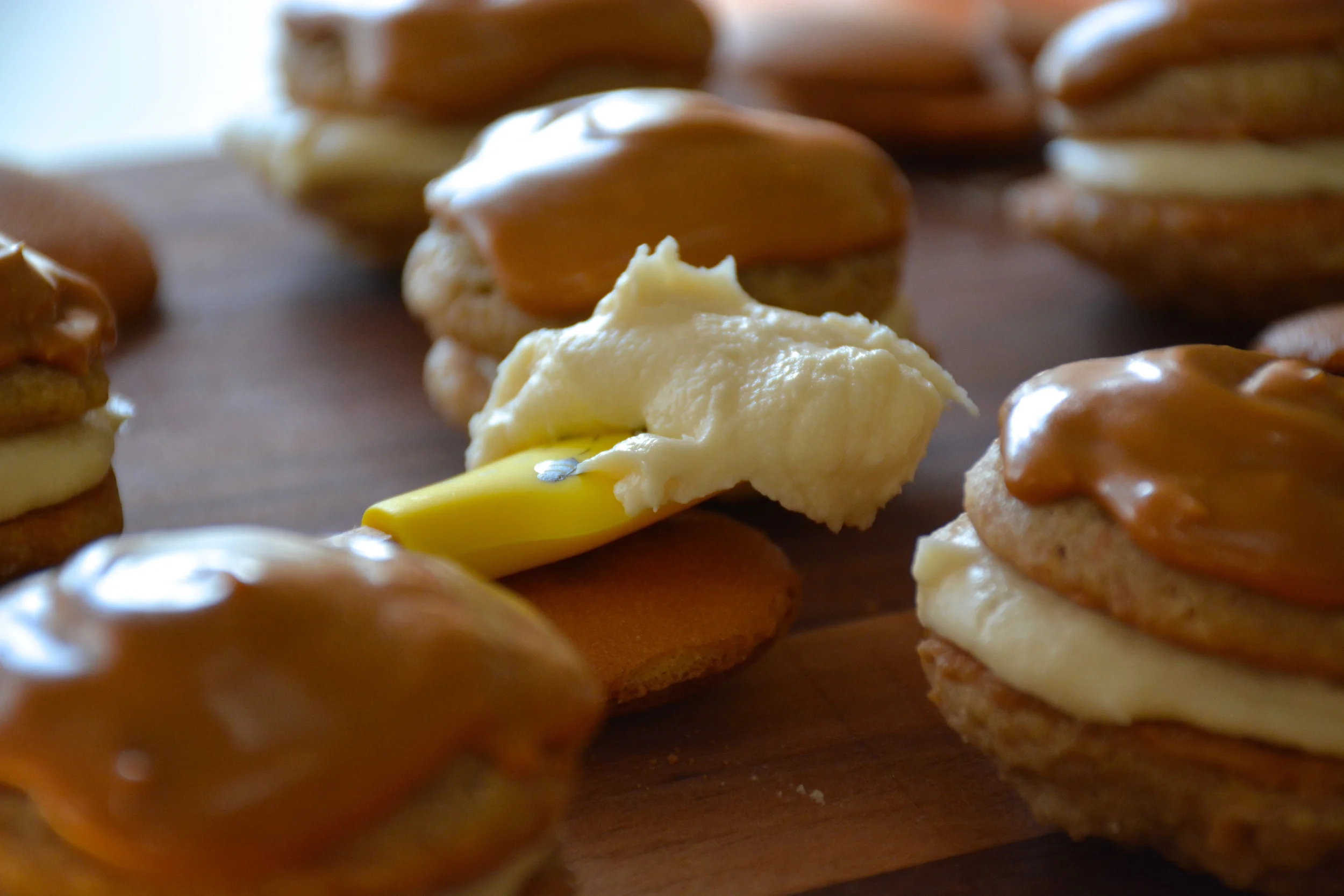 Banoffee Inspired Cookies - Banana Cookies with Vanilla Banana Cream Filling and Dulce de Leche Frosting