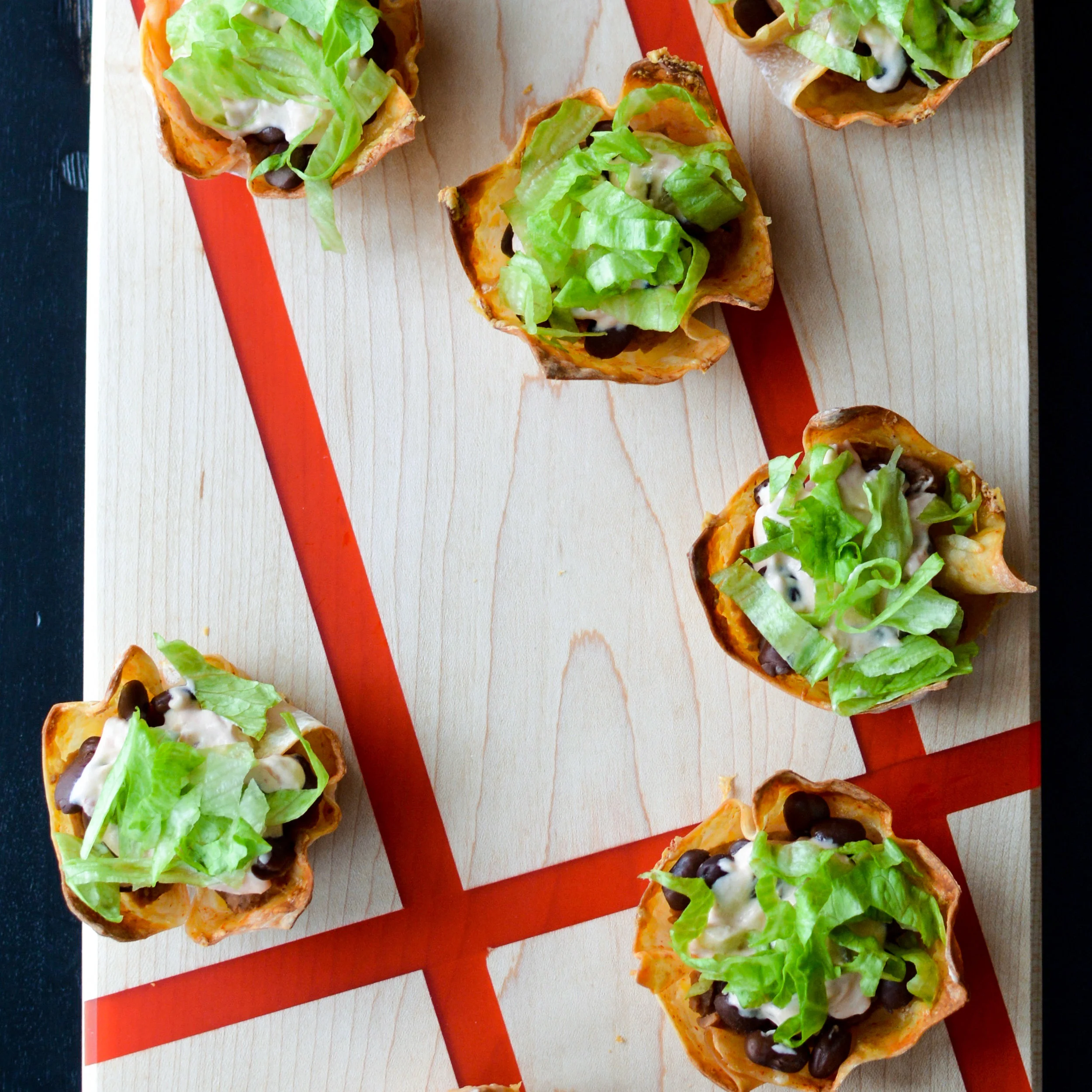 Black Bean Taco Dip in Crispy Cheddar Hot Sauce Cups