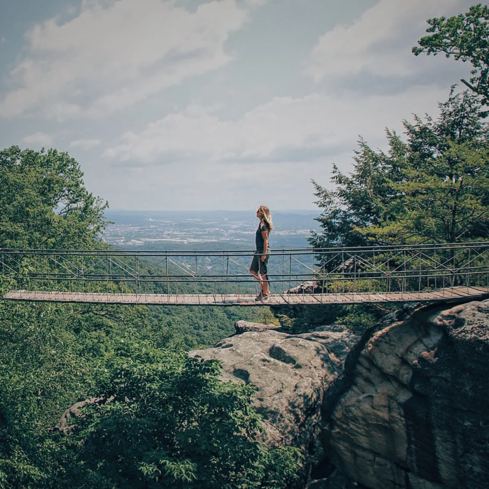 Walking on the suspension bridge in Rock City.