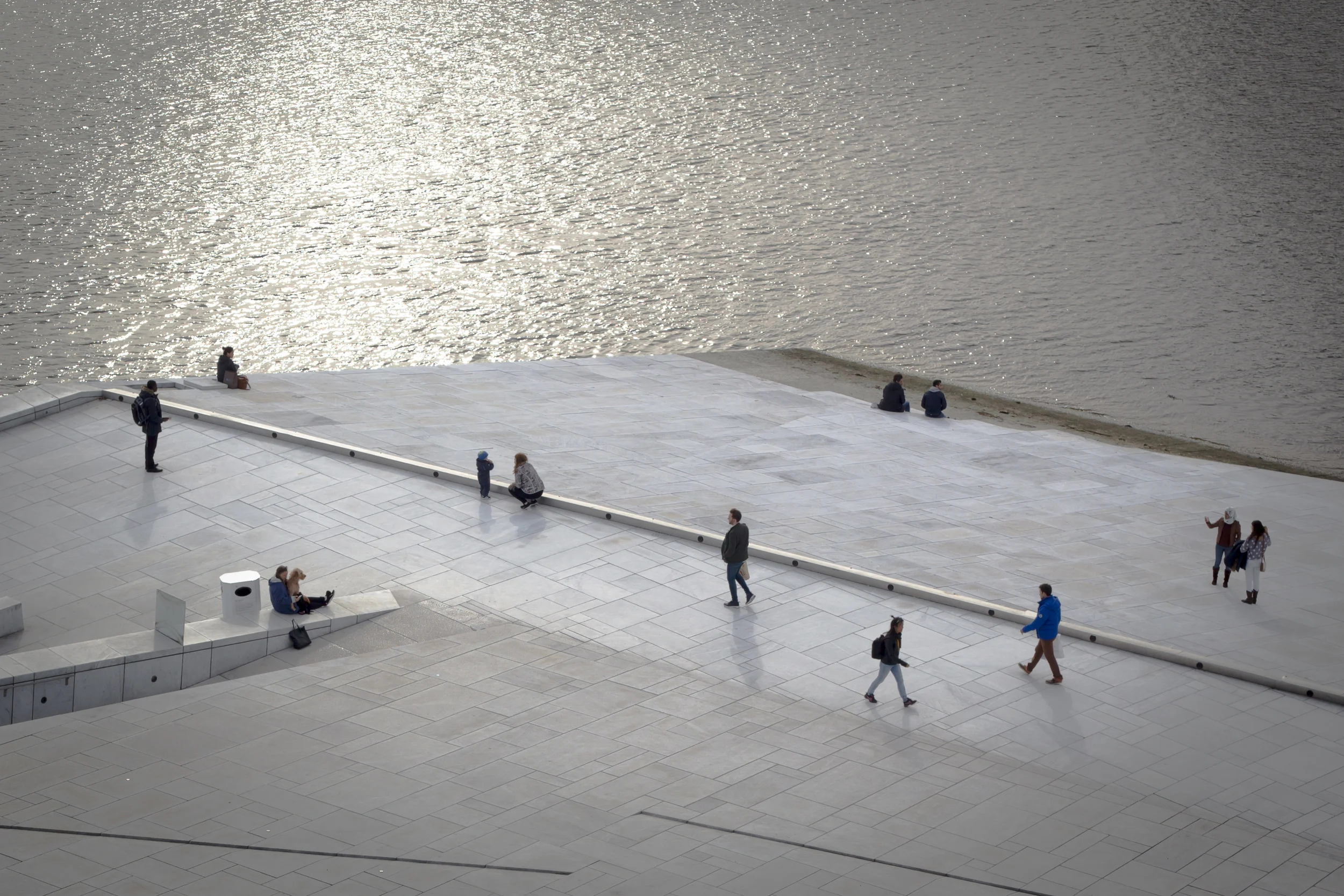 Visitors walking on the Opera House in Oslo