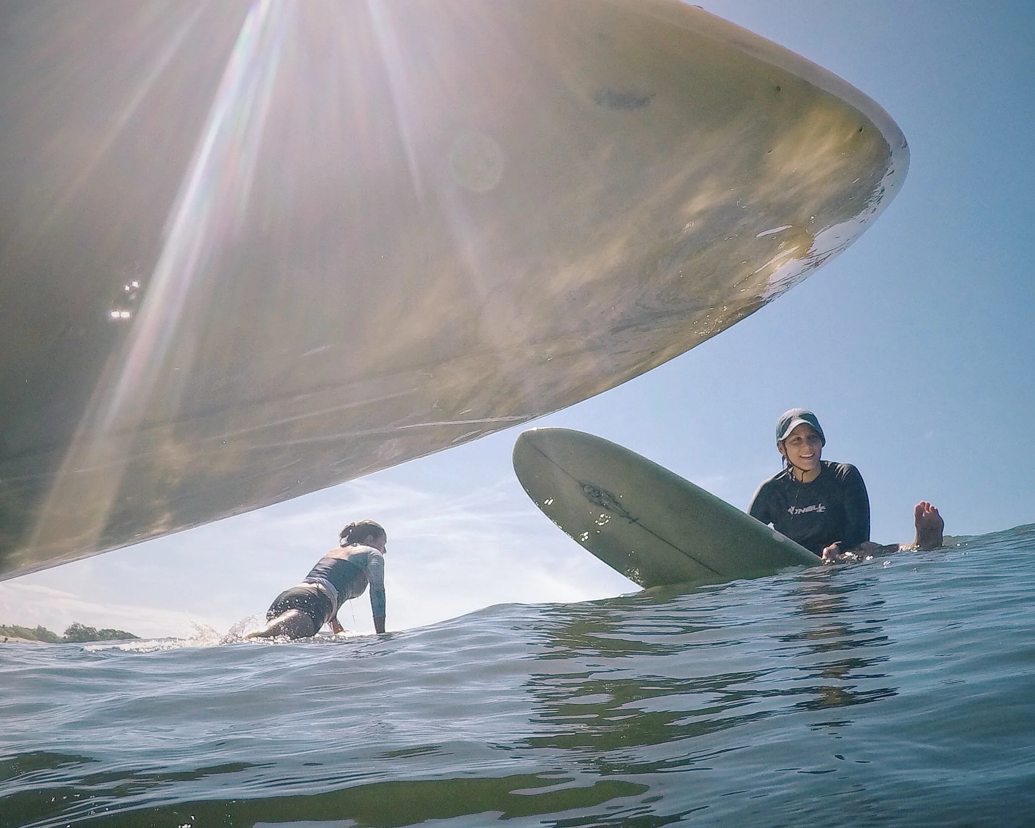 Amigas waiting to catch a wave