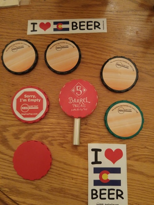 The set of items we provided Eric for his review, including a medium silver tap handle, some wood grain caps for use with homebrews and our "Empty" cap to limit disappointment when your awesome brew blows dry.