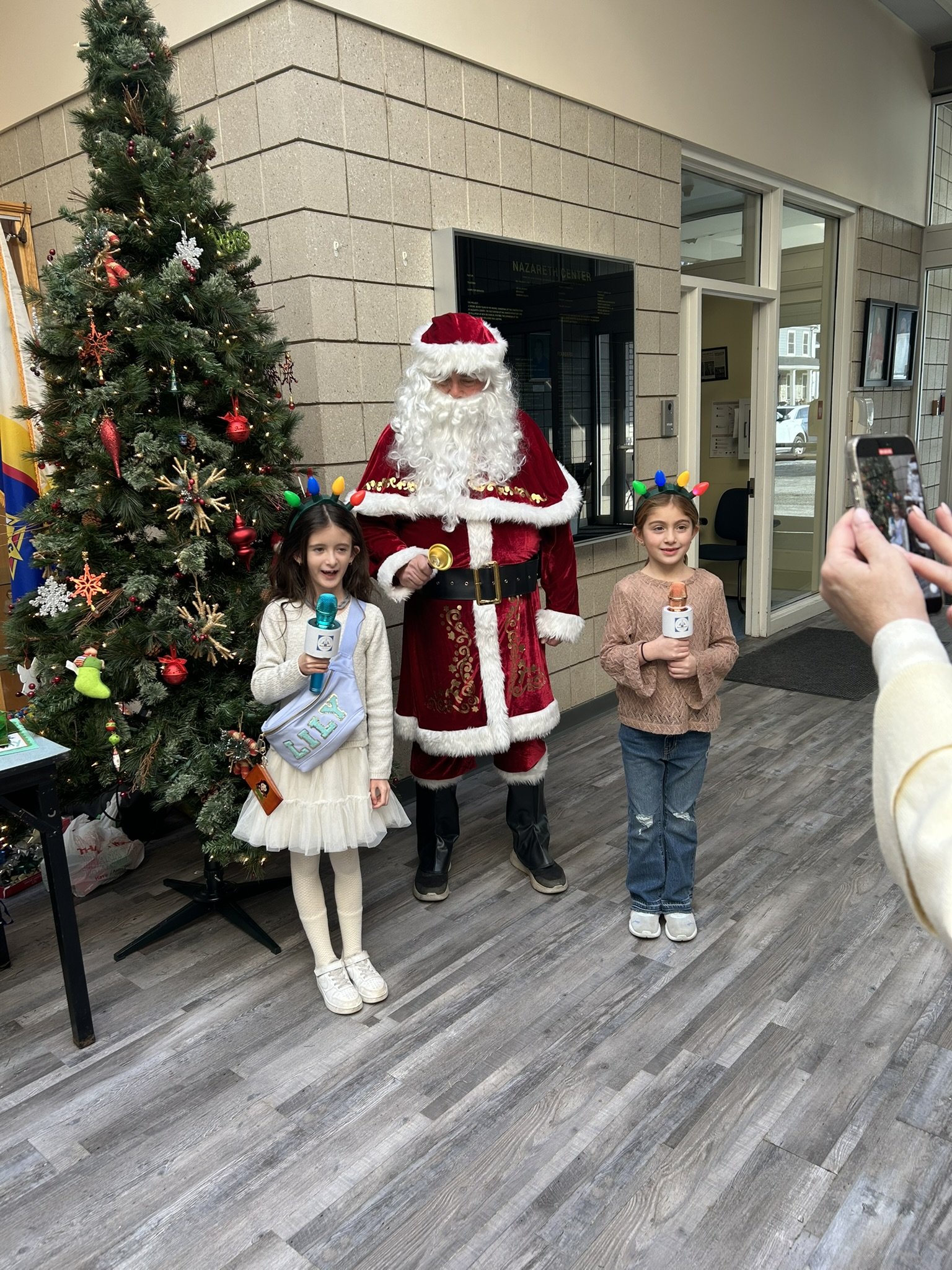IHM Kids News Network and Santa.JPEG