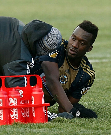 Sapong seen here eyeing bottles of "Riot Punch"