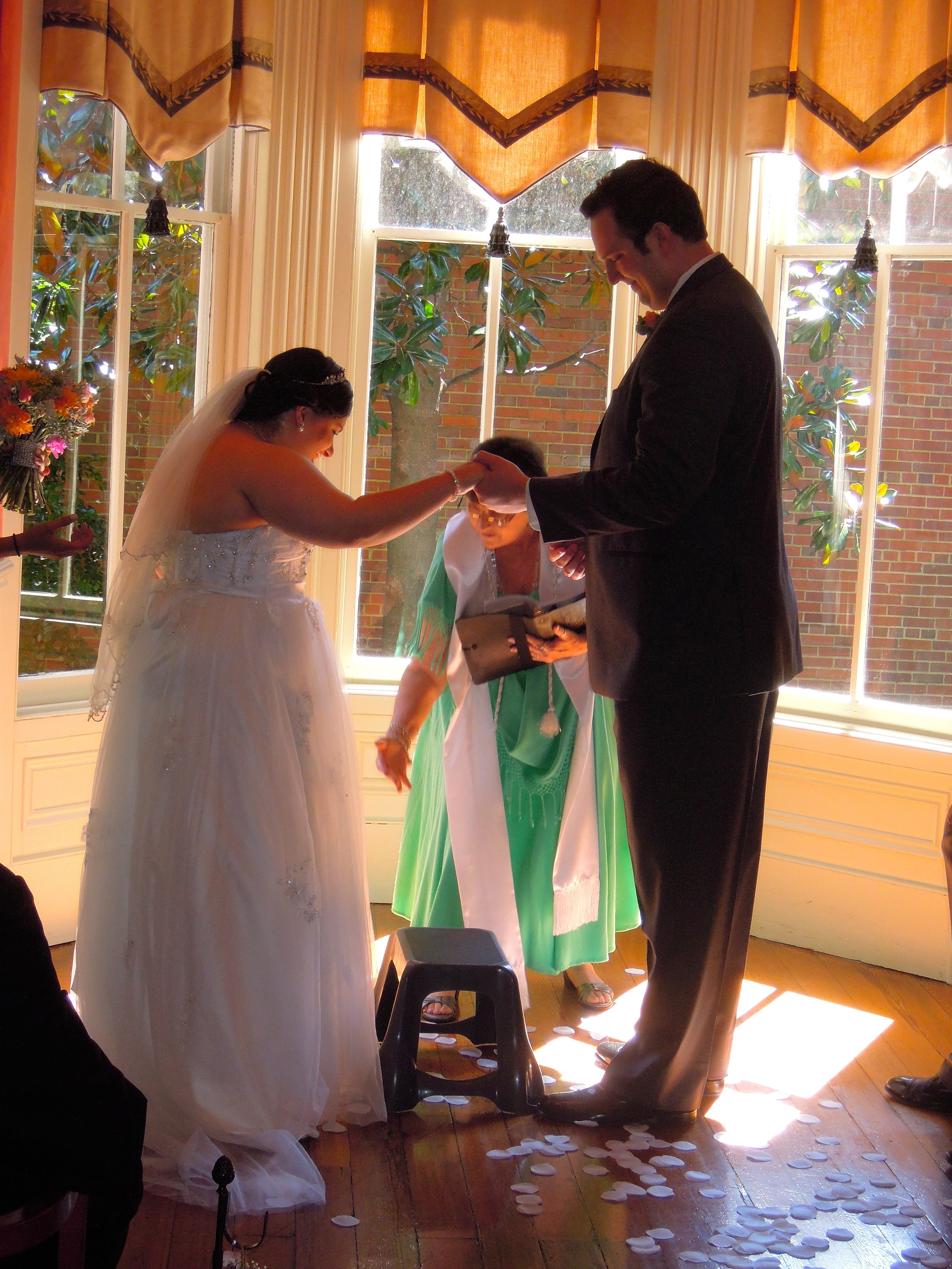 Bride stepping up onto stool for the kiss! 