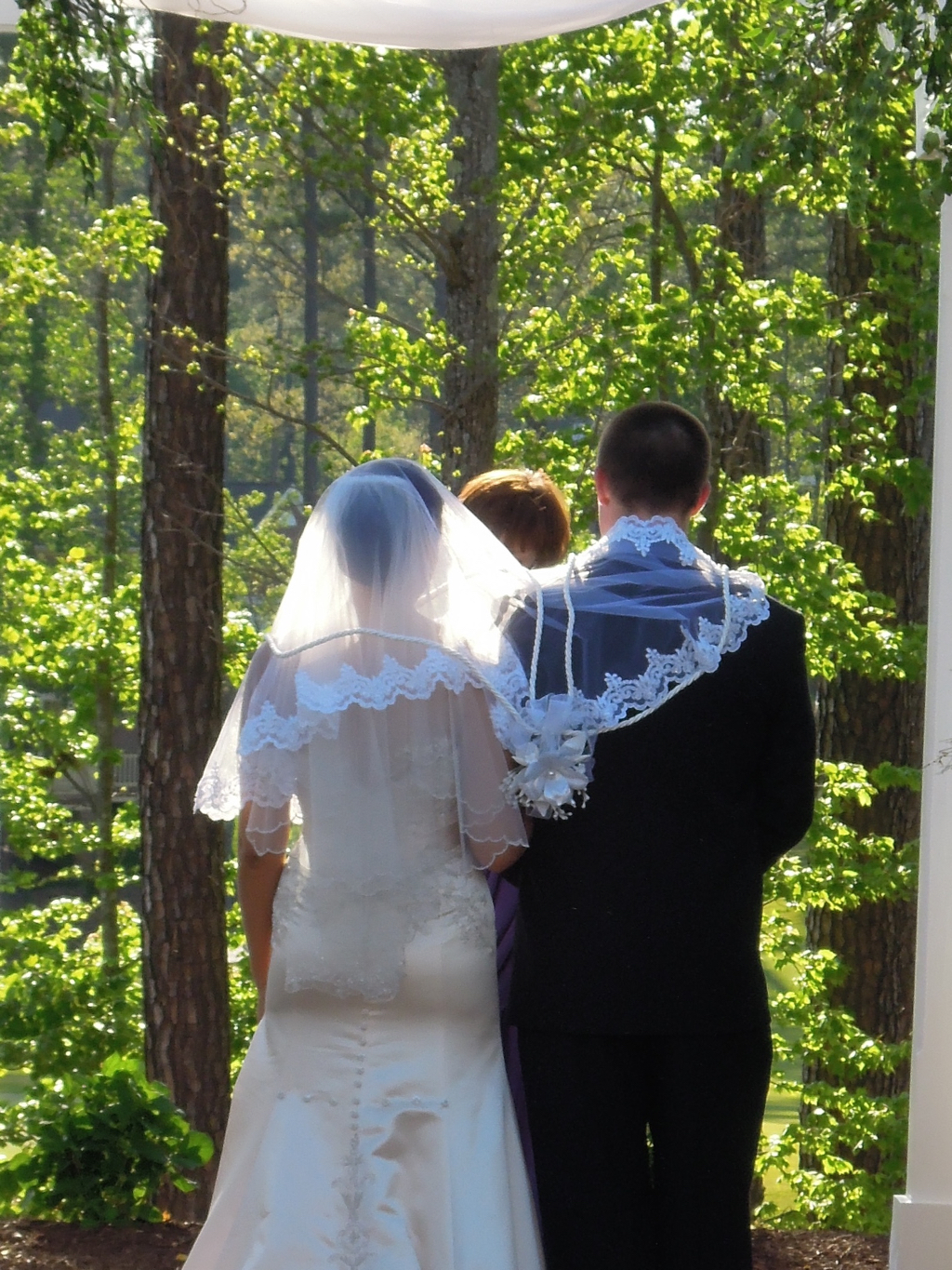  A rope/cord in the shape of a figure-8 are placed over their heads onto their shoulders.&nbsp; 