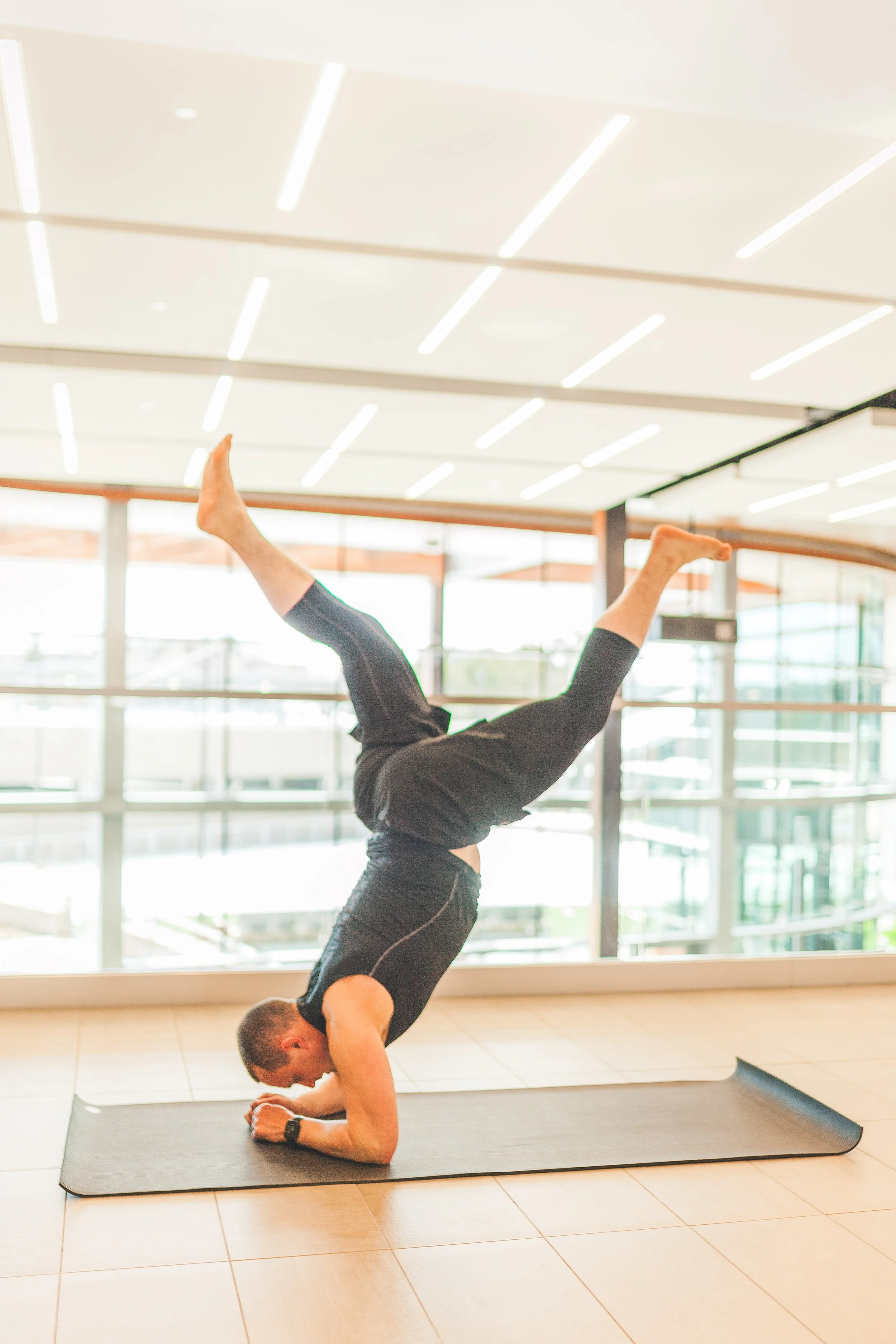 man handstand fitness wellness denver