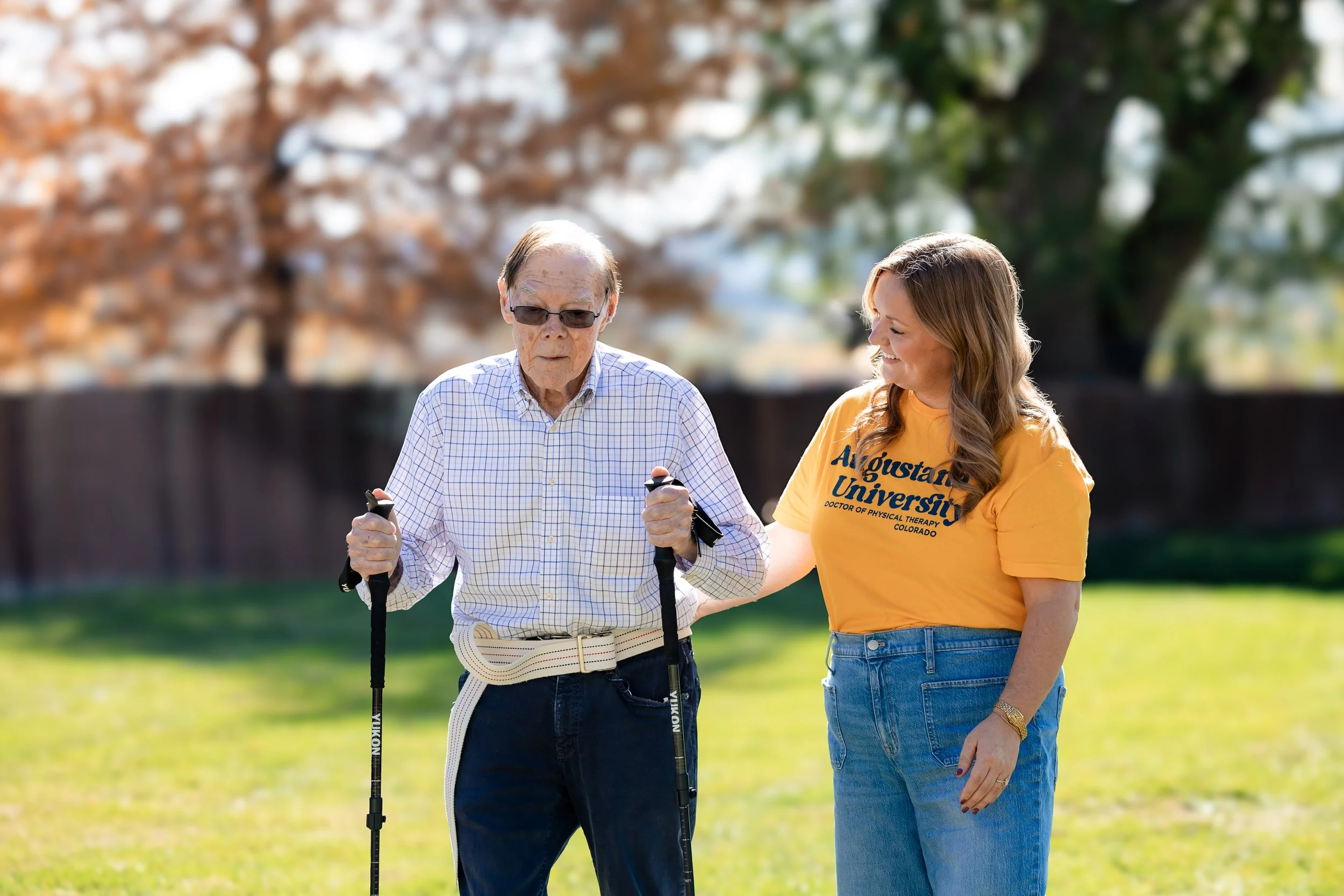 woman helping elderly man fall colorado