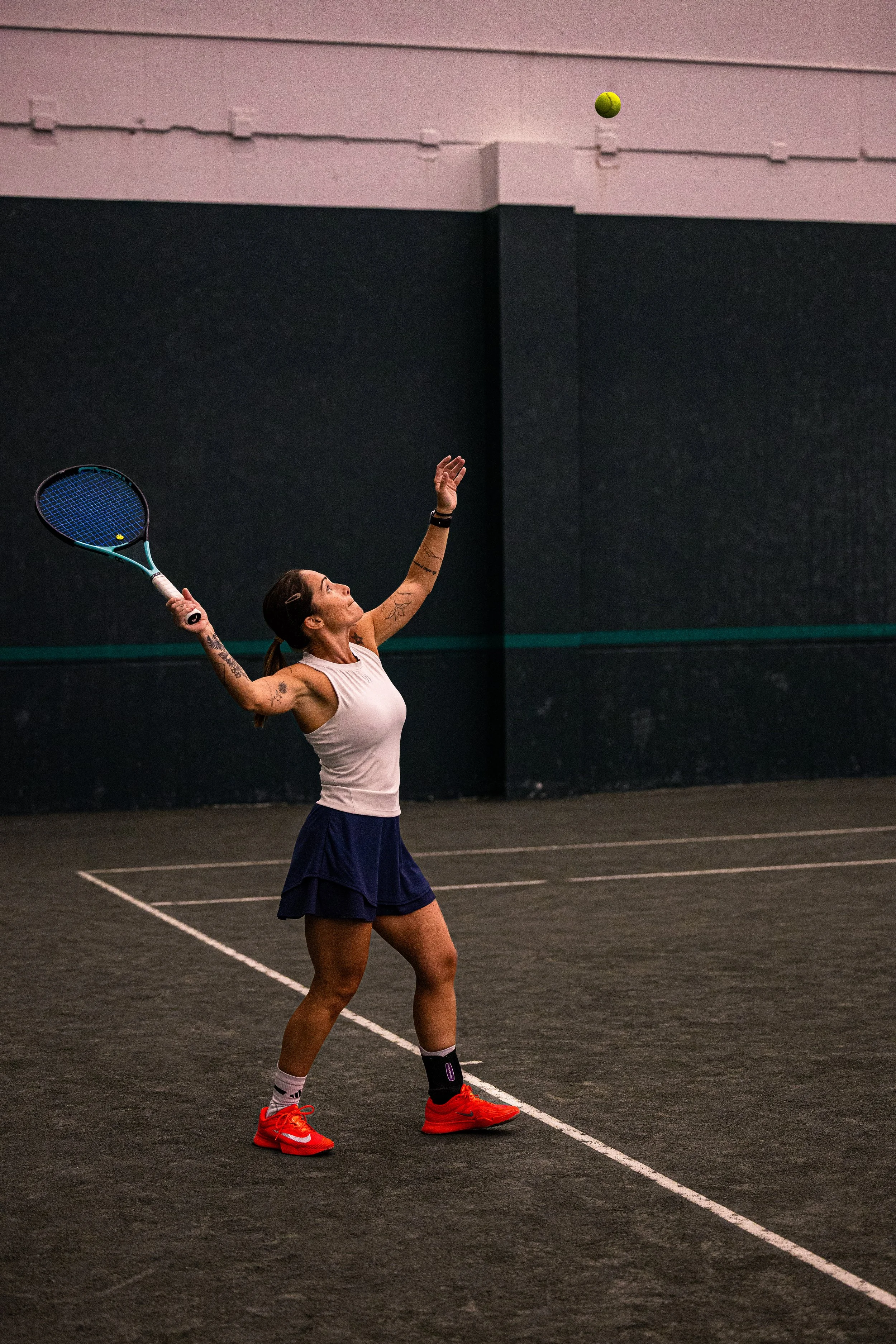 woman playing tennis athletic club greenwood denver fitness wellness