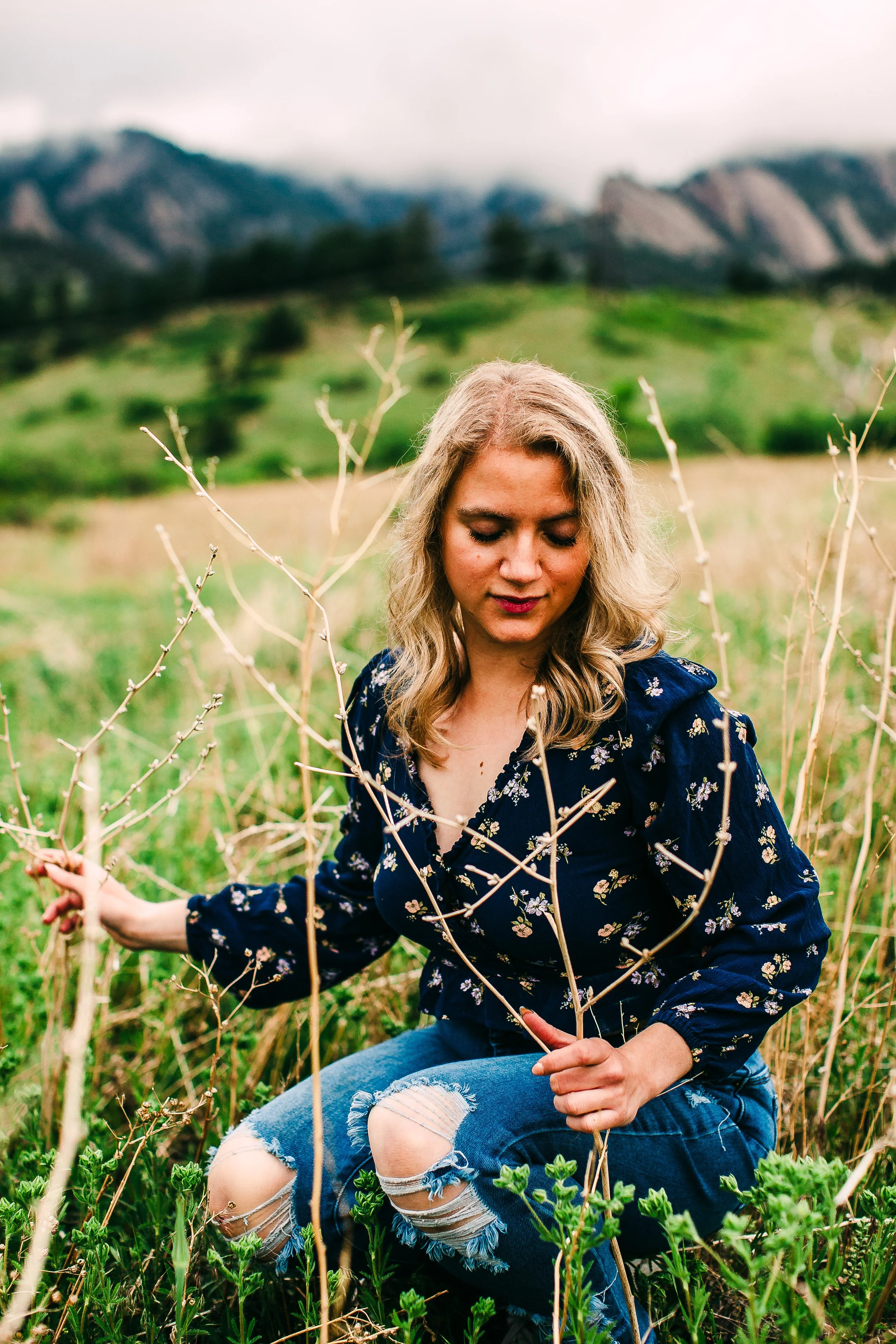 woman flatirons boulder colorado spring meadow