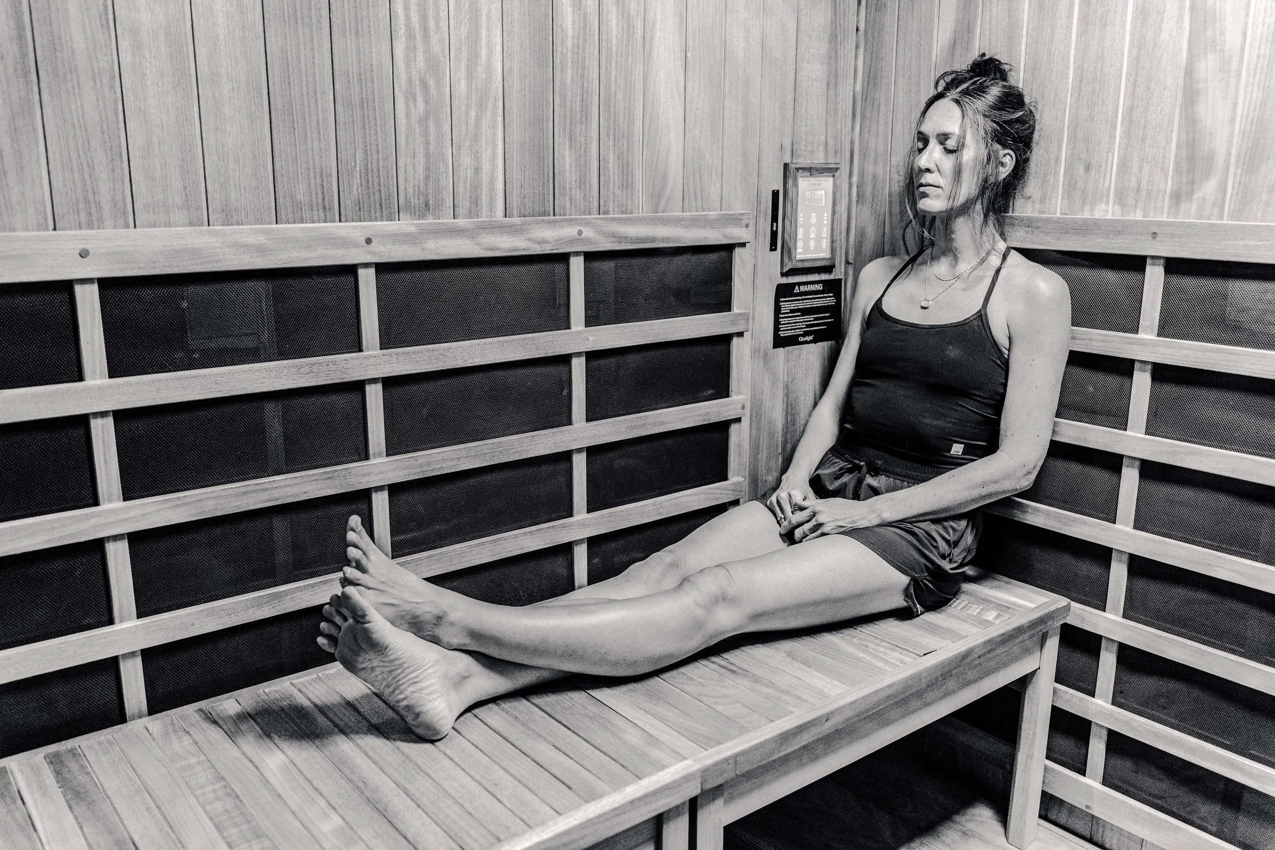 woman relaxing in sauna fitness wellness denver