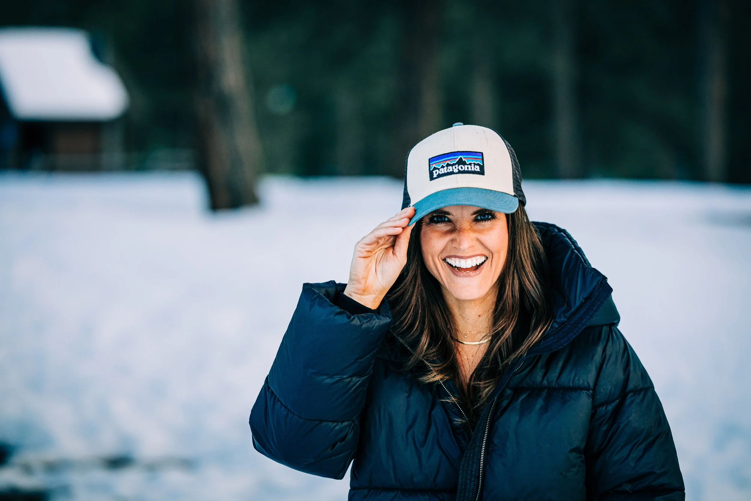 patagonia hat snowy winter colorado woman smiling