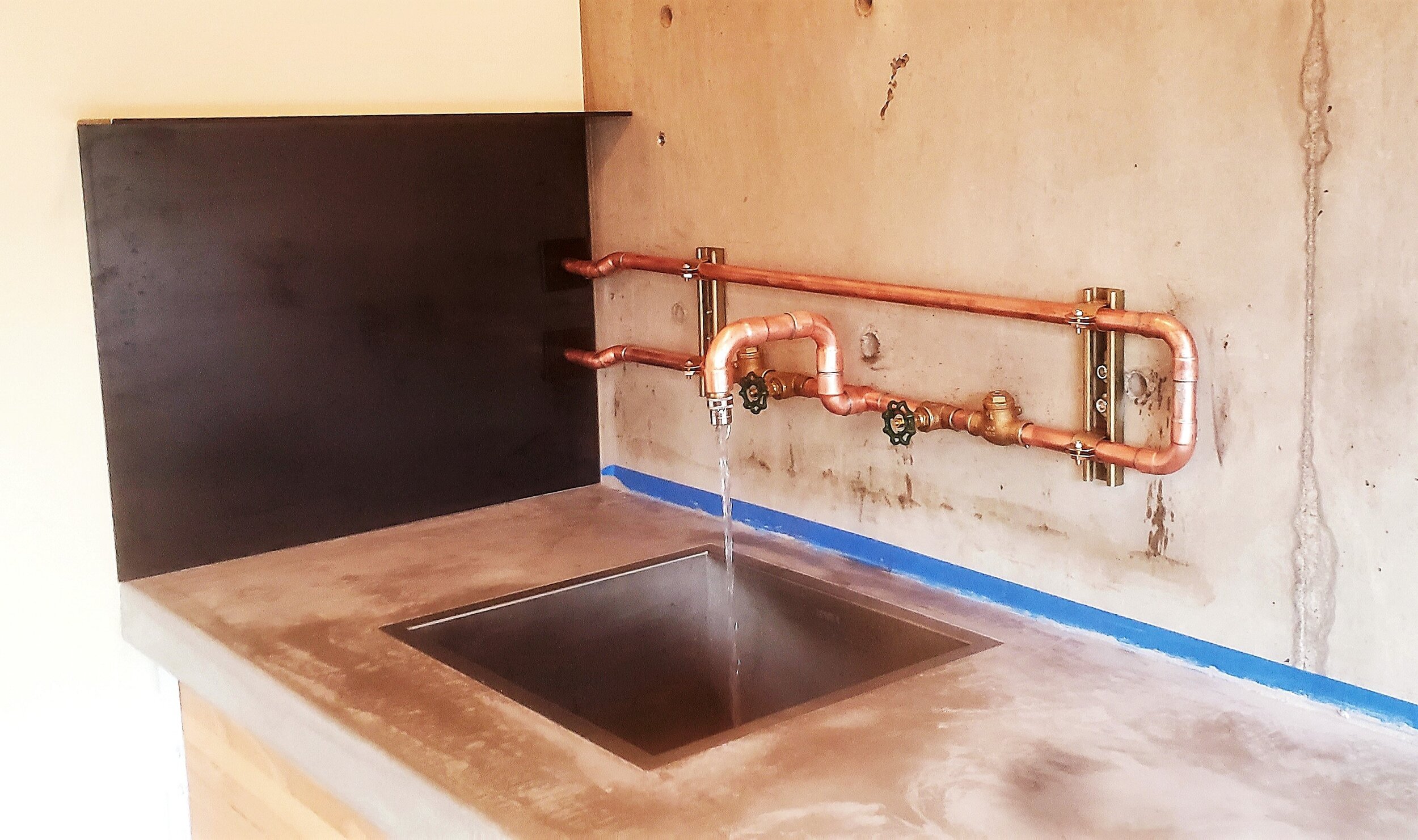 Custom Copper Faucet and Concrete Counter