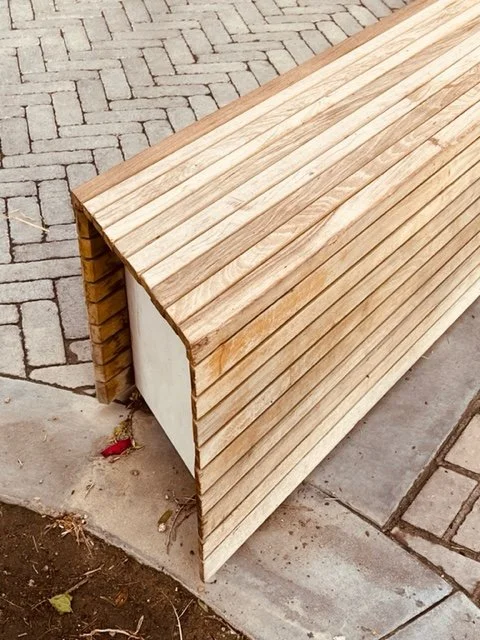Not just a bench! Love those mitered corners, cantilevered planks, and angled edge