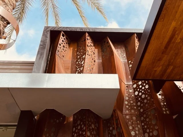 The folded steel facade also penetrates the slicing roof plane