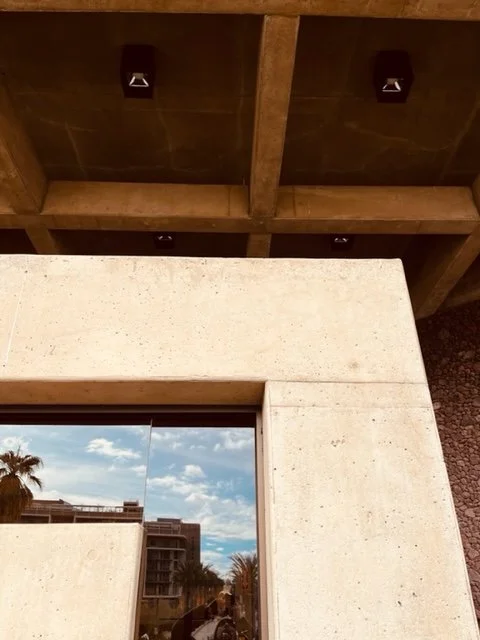 The dominance of this concrete form in the foreground gives prominence to the coffered concrete roof hovering above 