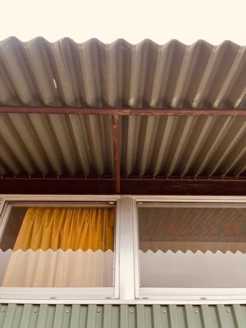 This simple metal tube creates the rough support needed for the roof overhang