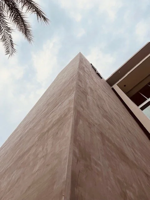 By putting this dominant concrete form at sidewalk level, it allows you to experience its massiveness at a pedestrian scale