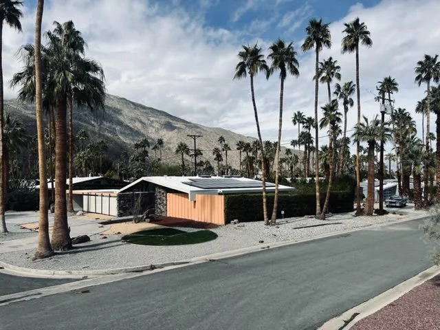 The contrasting wall plane becomes a fence as it slices beyond the house