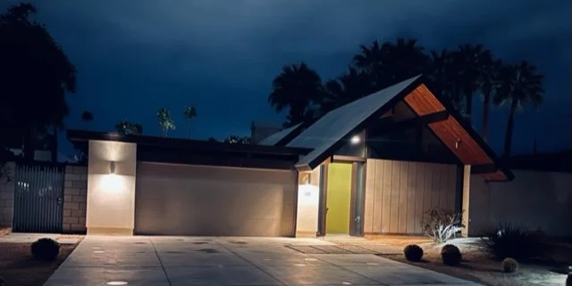 The contrasting textures of the garage wall, garage door, house door, house wall, and ceiling all work together to create interest