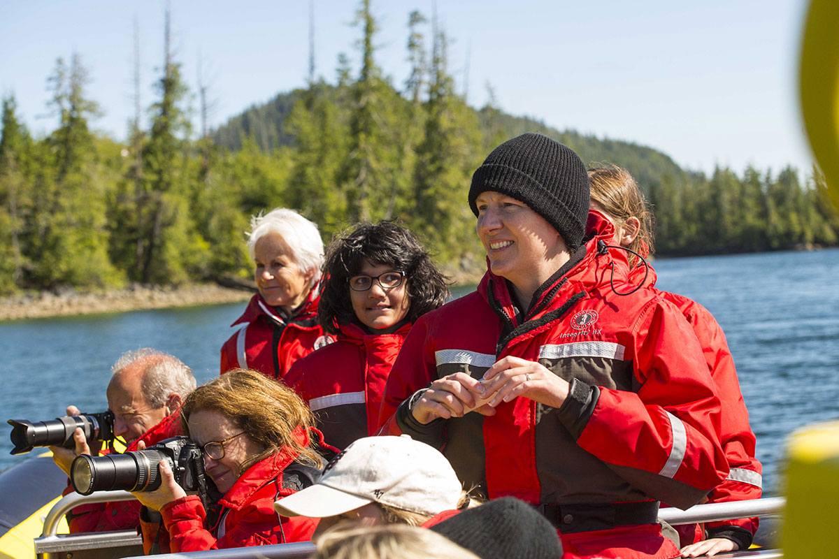 A guide with some happy guest on a whale watch in Tofino, BC.