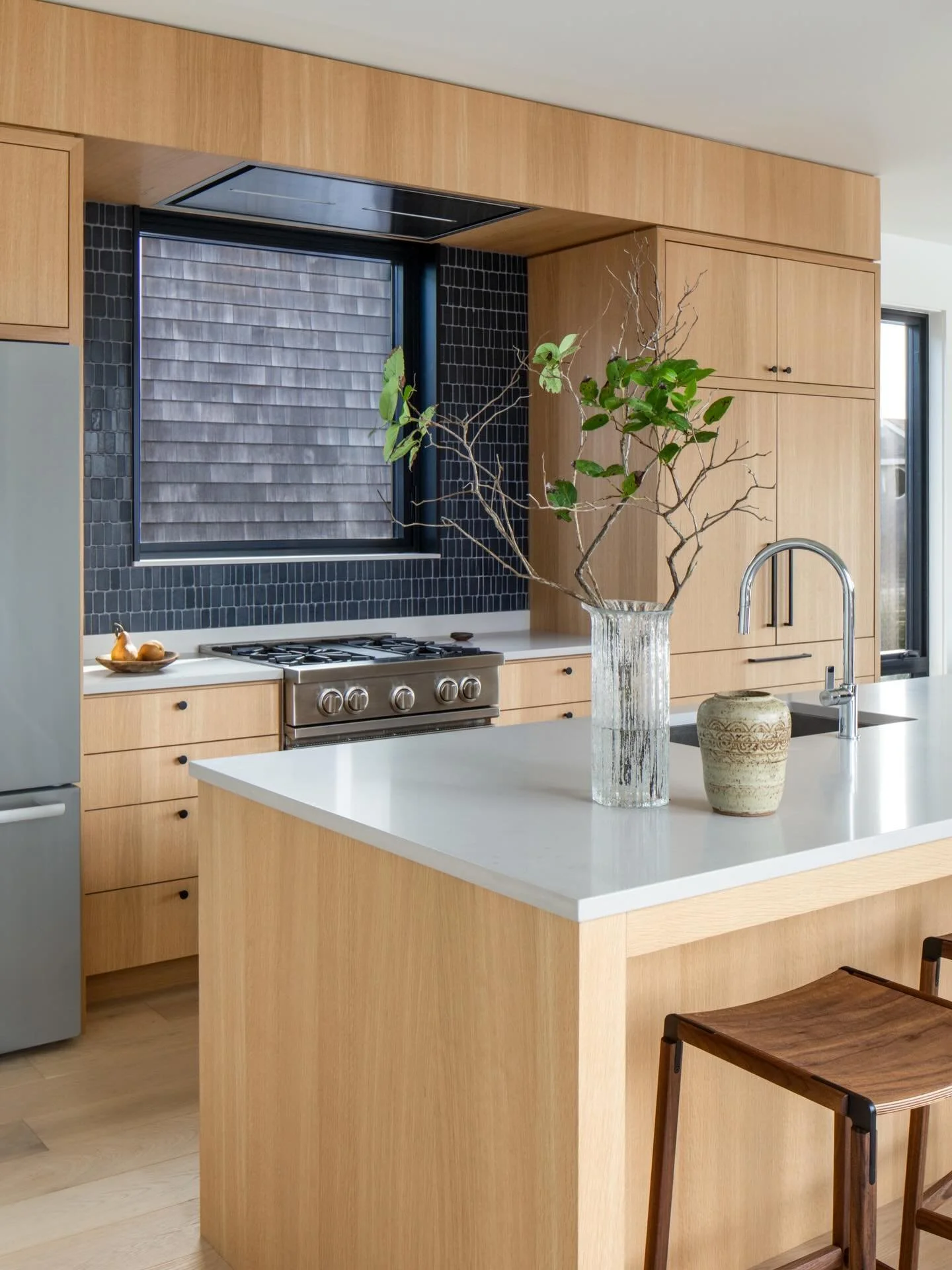 The kitchen finish palette of white oak, walnut, and natural tumbled nero marble compliment the connection to exterior Japanese cedar cladding.

Architecture + Interiors @theguggenheims 
Photography @themorrisonsphoto
Photo Styling @shopwilma @karieh