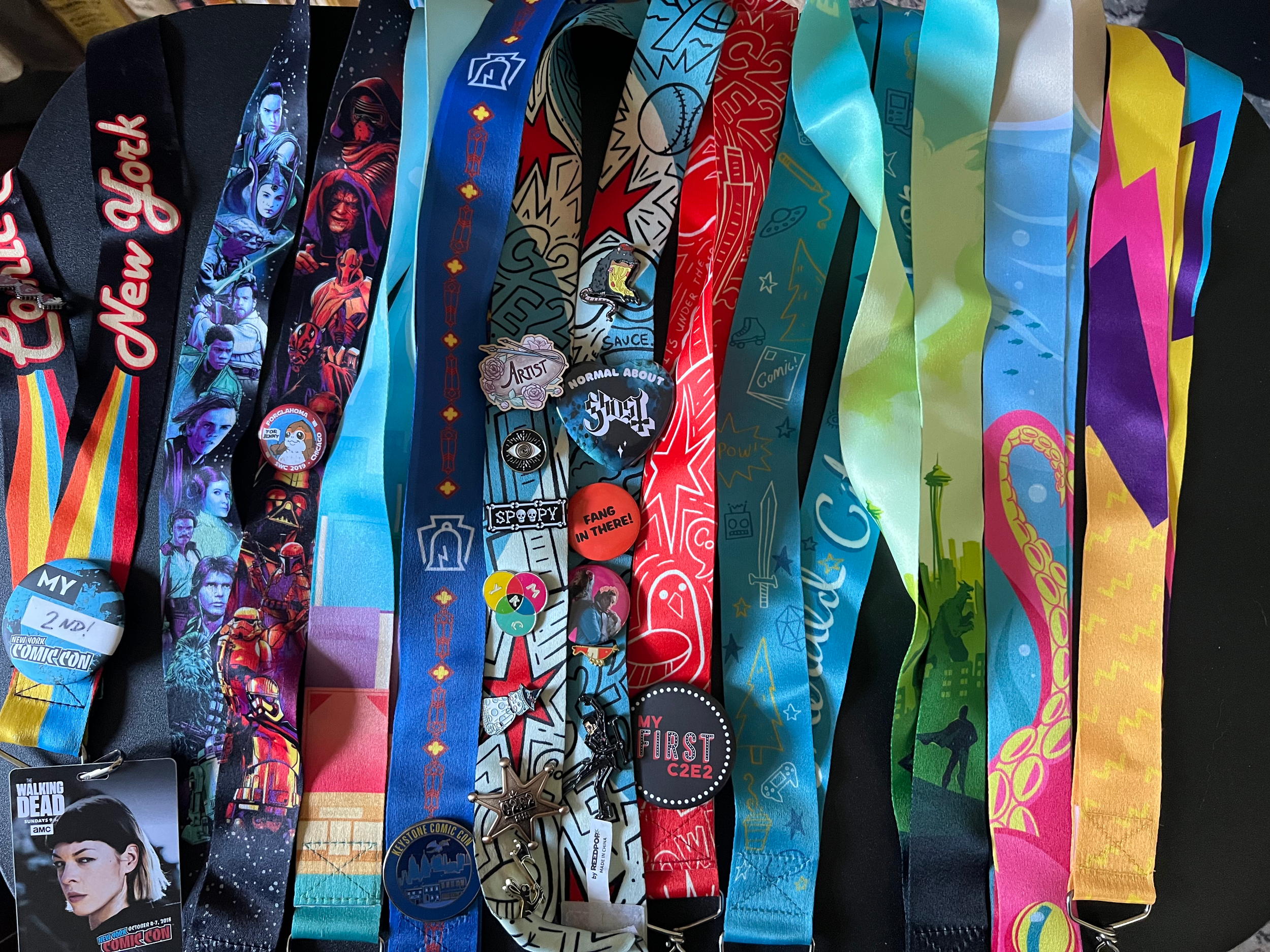 A collection of my lanyard designs for various conventions!