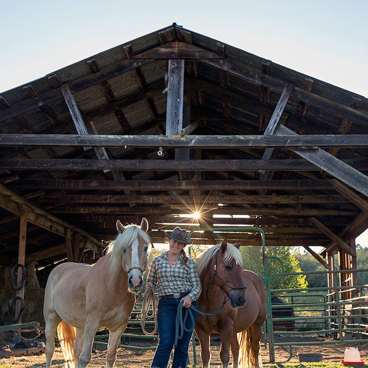  Big Table Farm – Clare with her draft horses. 