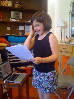 TMWFI-student-reading-her-work-out-loud2.jpg