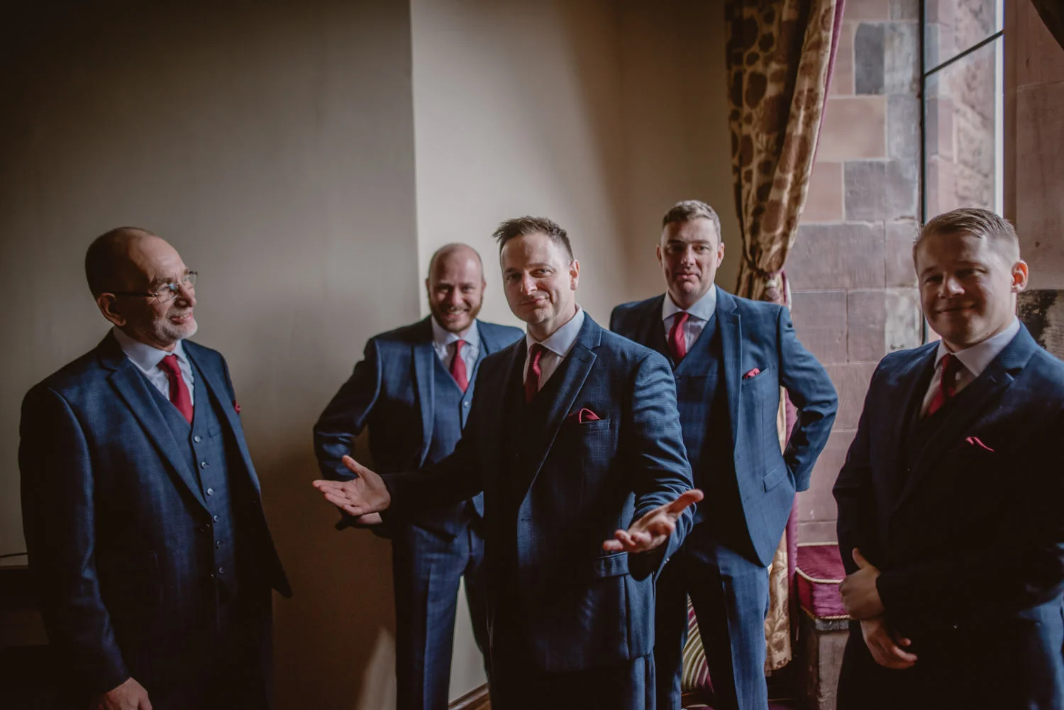 Groom, father of the bride, ushers and groomsmen getting ready for the ceremony at Peckforton castle