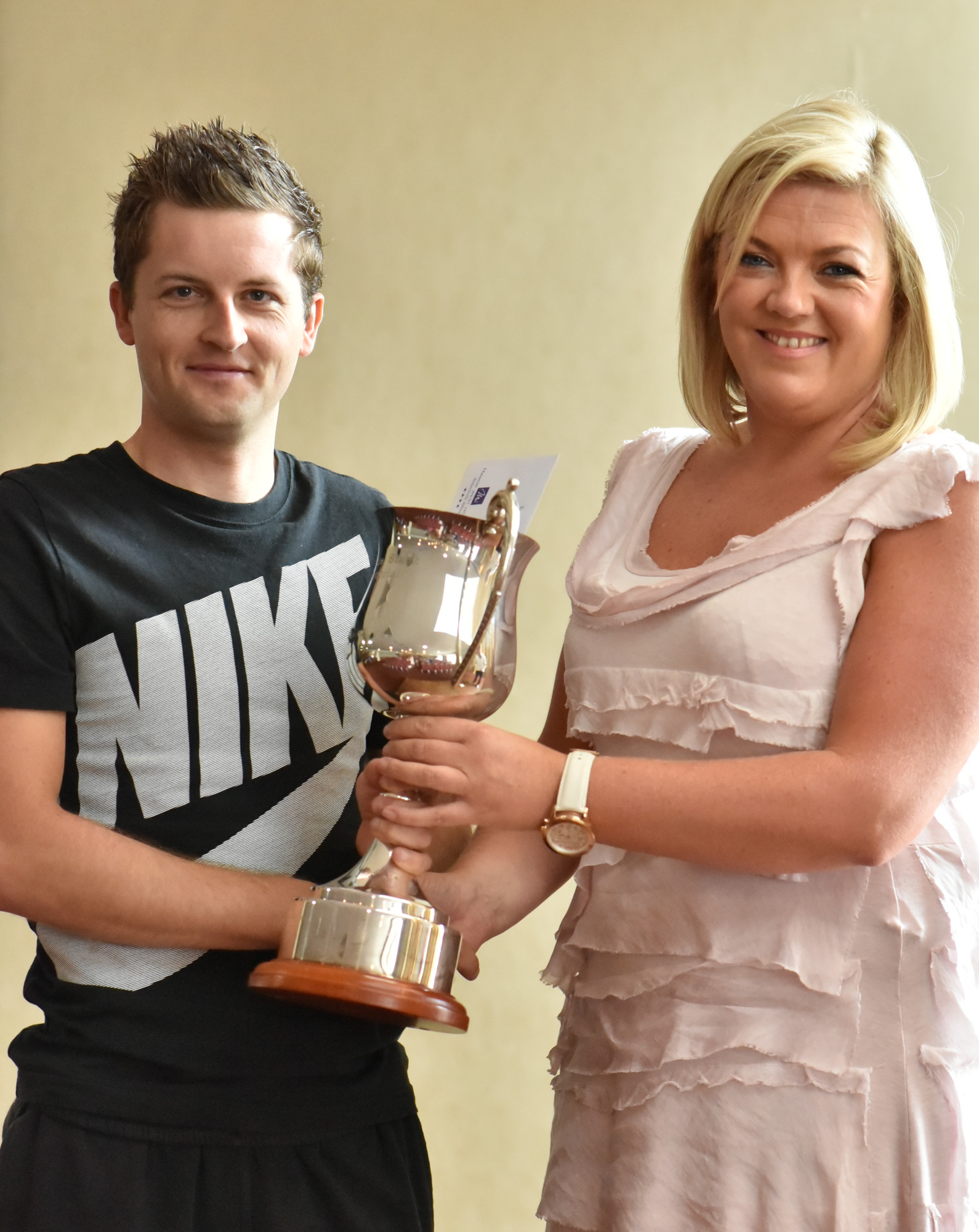 Mark Dowling being presented with the Michael de Staic Memorial cup by Michael's daughter Orla