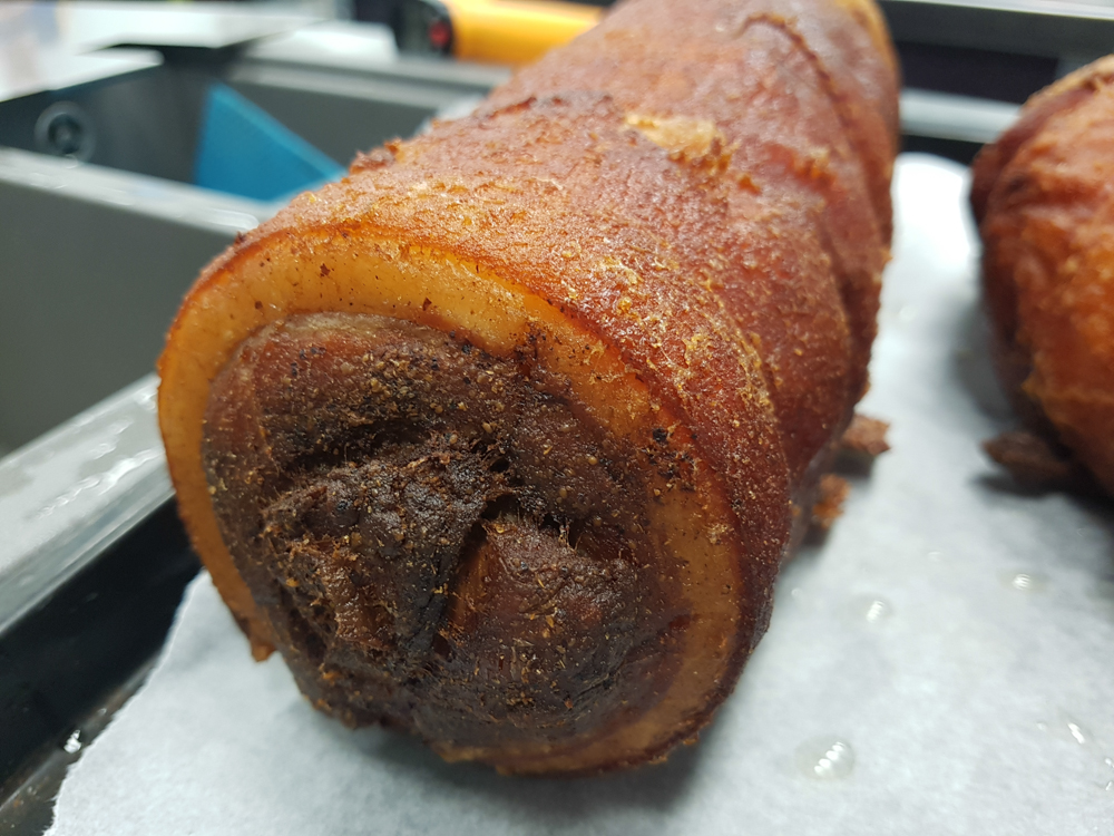  Deep fried pork belly roll, stuffed with smoked garlic, prunes and long pepper 