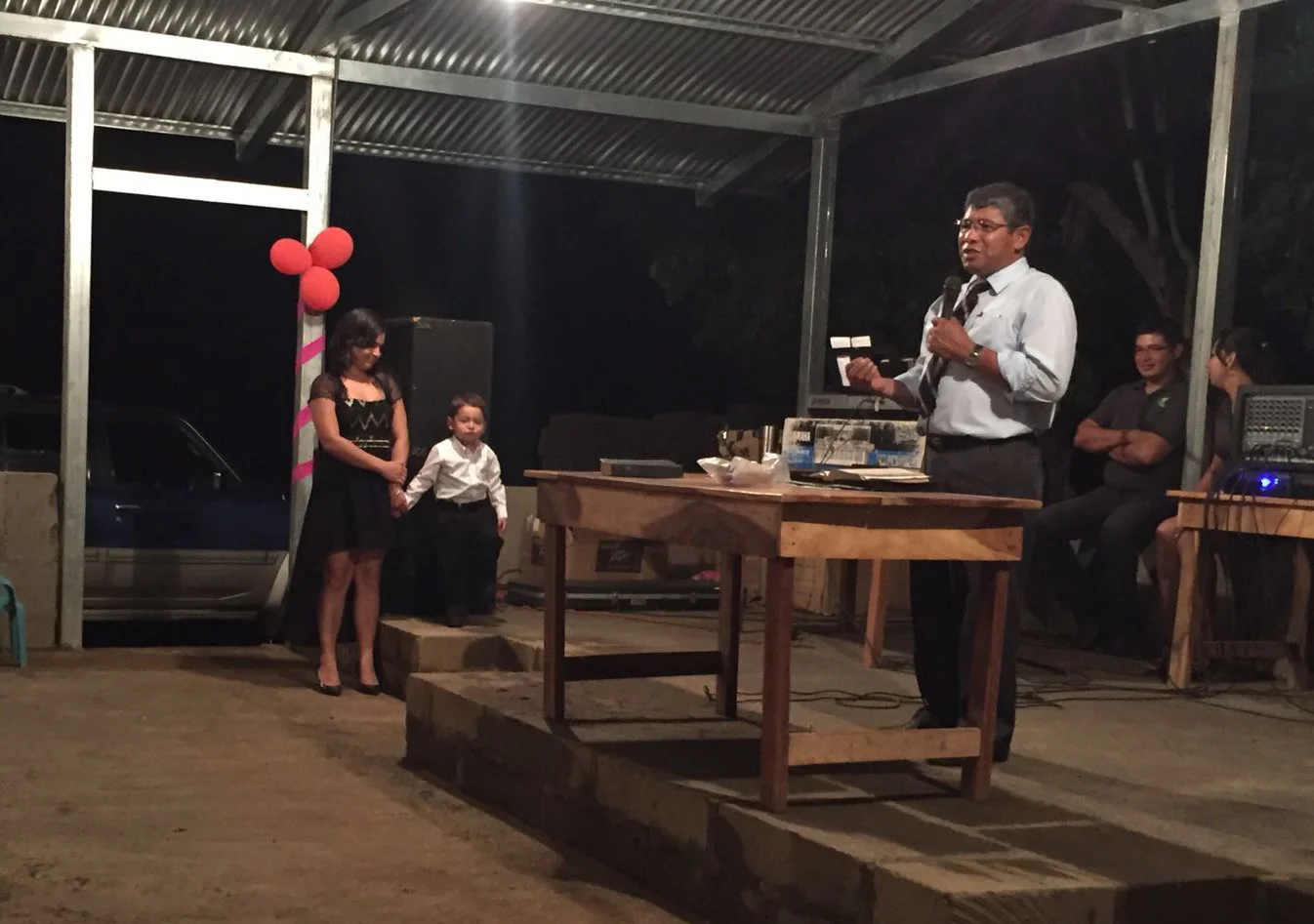 Pastor Luis preaching at the church dedication service.