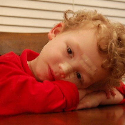 small child - folded hands and head on table (2).jpg