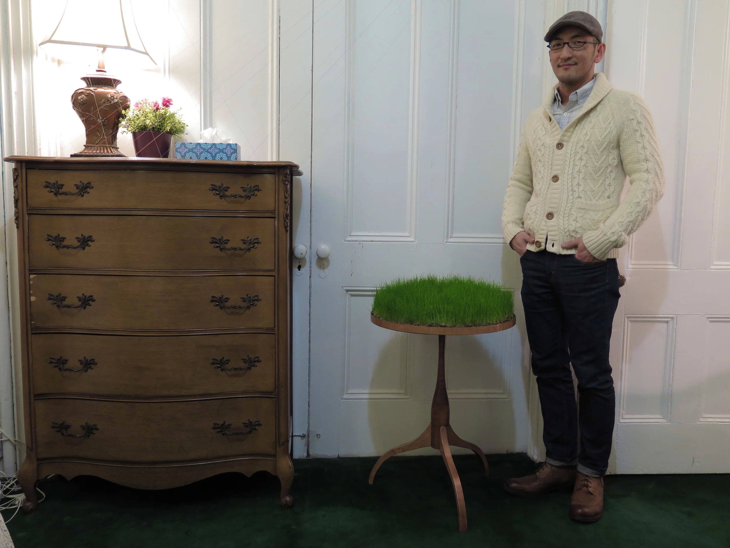    The Grass is Always Greener   by Yasunari Izaki  The spacial constraints of NYC apartment living require a minimalist approach to most things. This necessarily affects life style, possession limitations, and priority of value. We live with dreams,