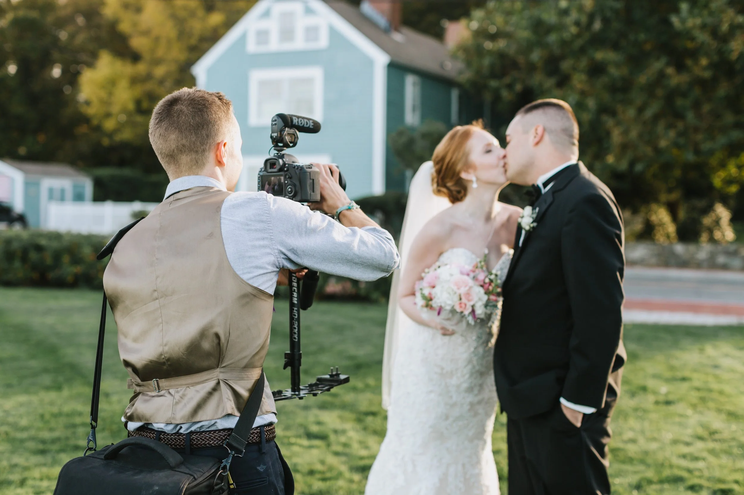 One of our videographers, Brendan, capturing a special moment between Andrea & Dan during a beautiful shoot in Newburyport, MA. Photo credit: Lena Mirasola Photography.