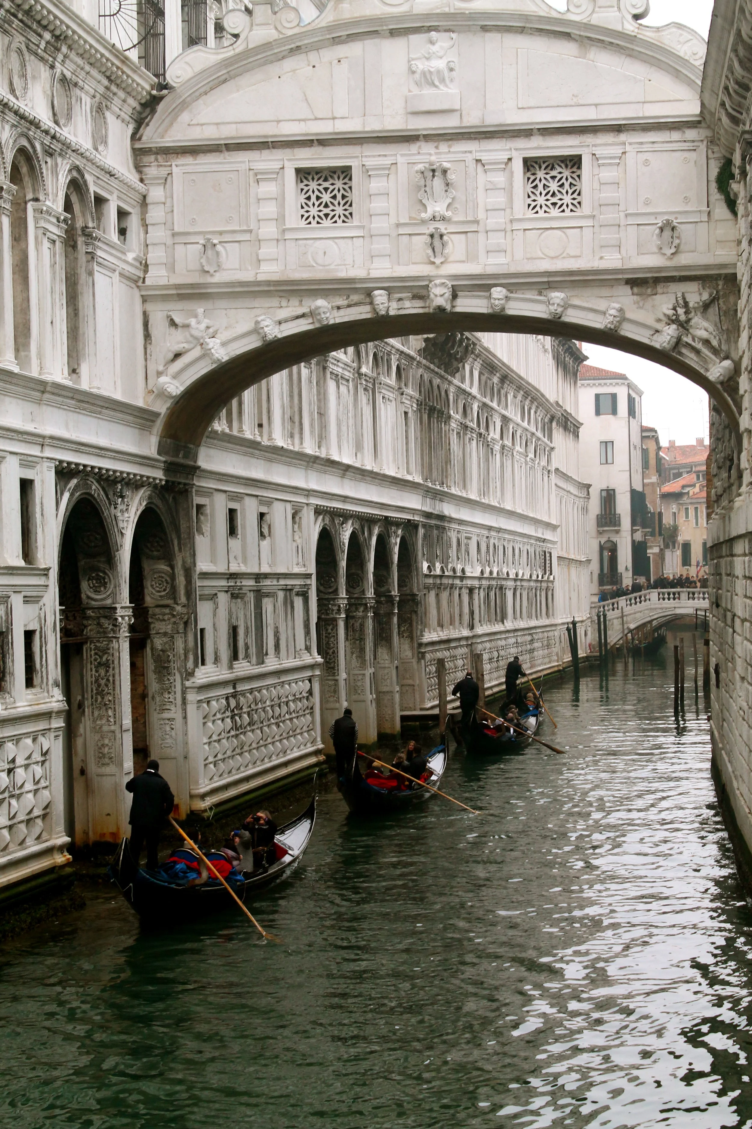 Gondolas floating through the canals of Venice