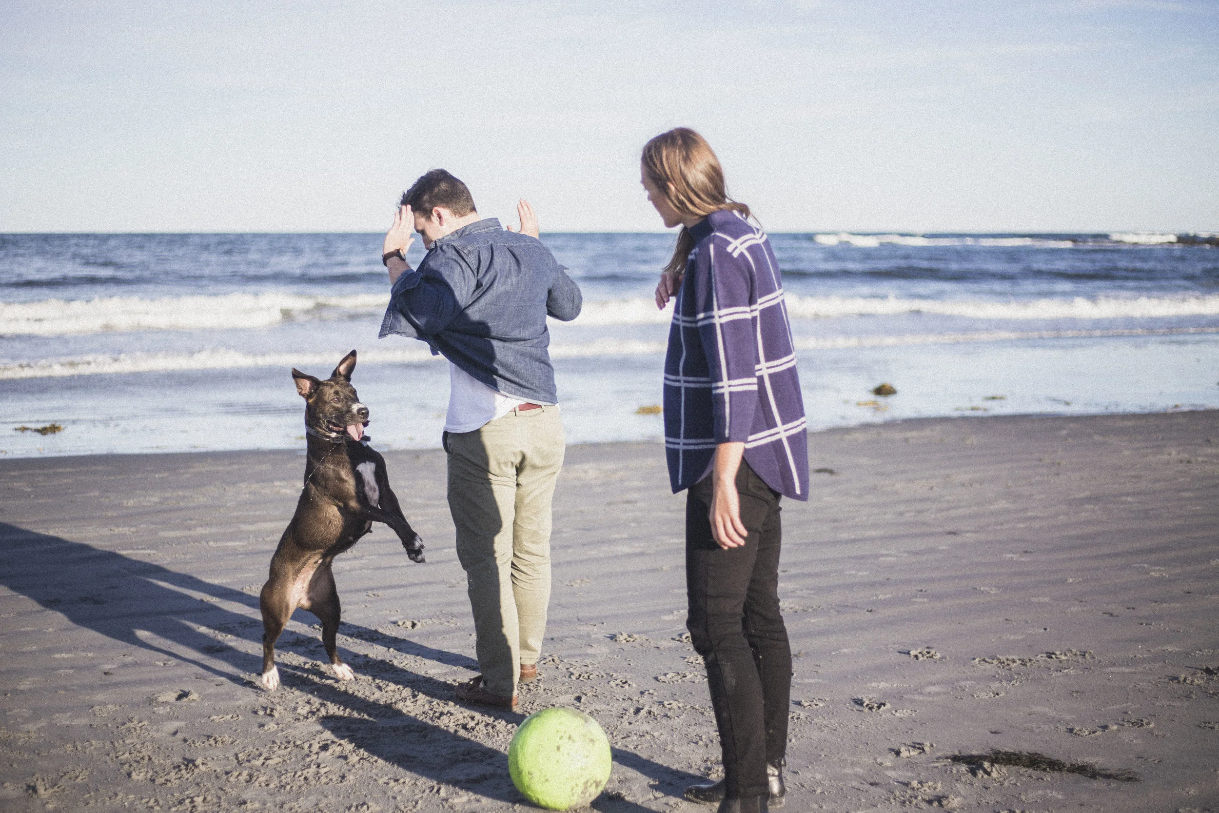 A couple shoot with their dog at Seapoint Beach in Kittery, Maine