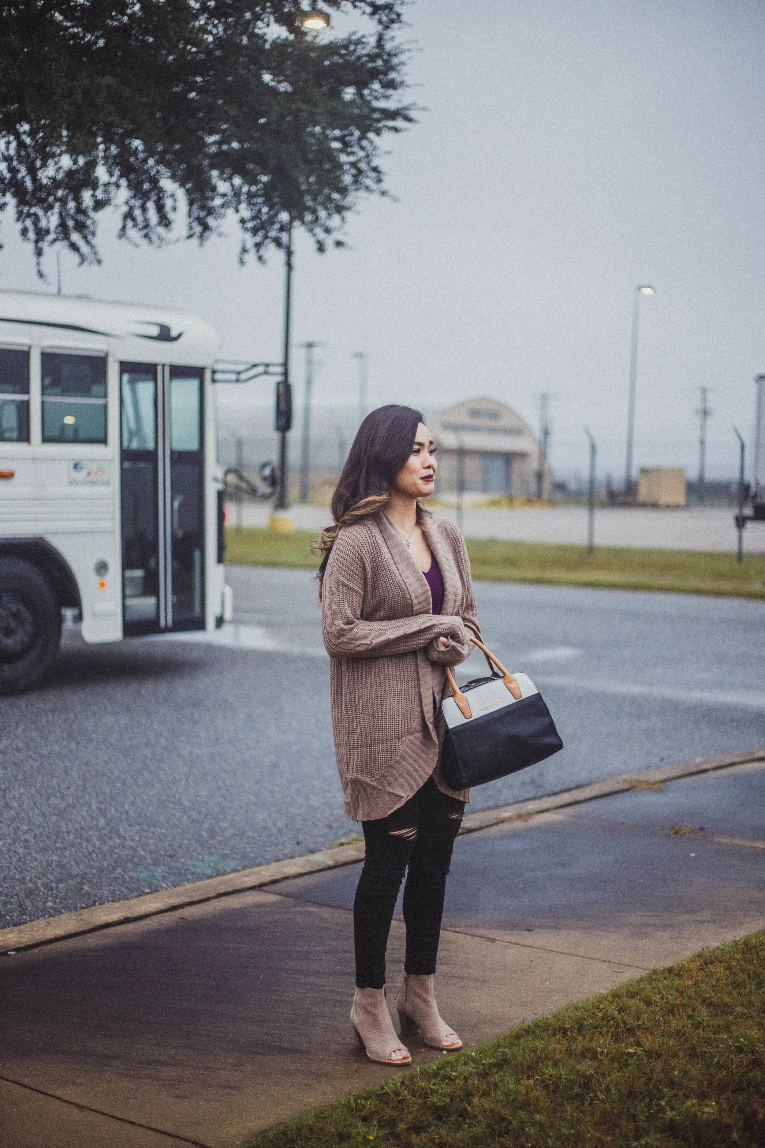 Army wife waits as her husband’s plane lands for his Military homecoming in Fort Benning, GA