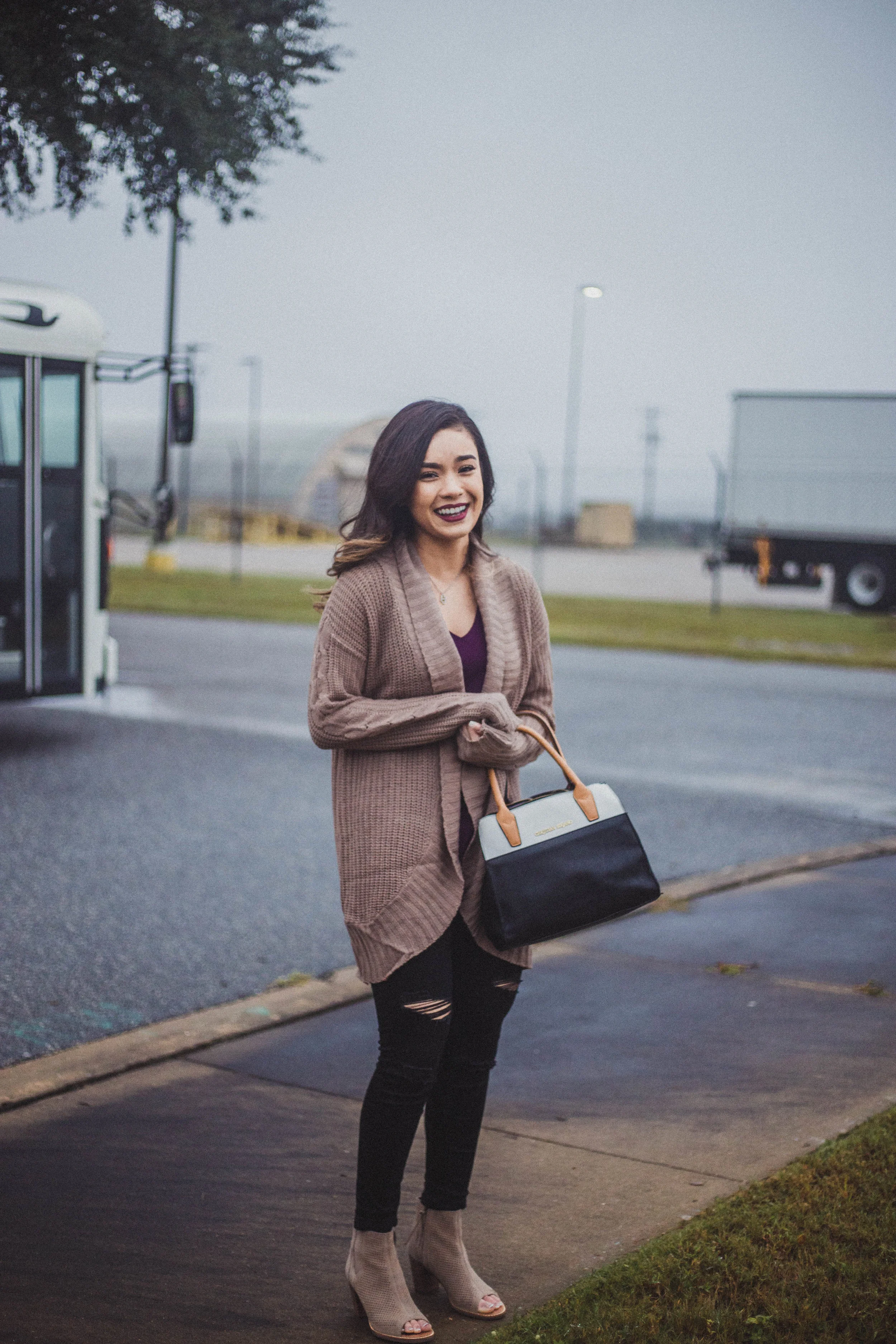 Army wife waits as her husband’s plane lands for his Military homecoming in Fort Benning, GA