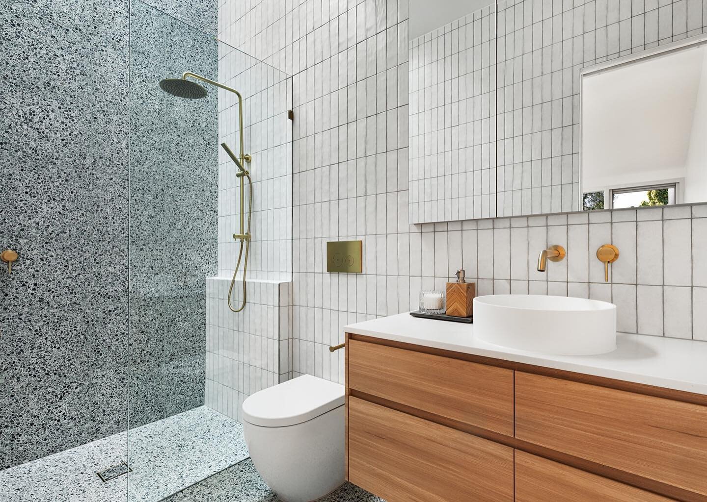 Illuminated by the skylight above, this en-suite successfully heroes a swathe of current bathroom trends, bringing modern beauty to a traditionally functional space.
.
.
.
PM &amp; construct: @matclair_constructions 
Tapware: @abiinteriors 
Tiles: @n