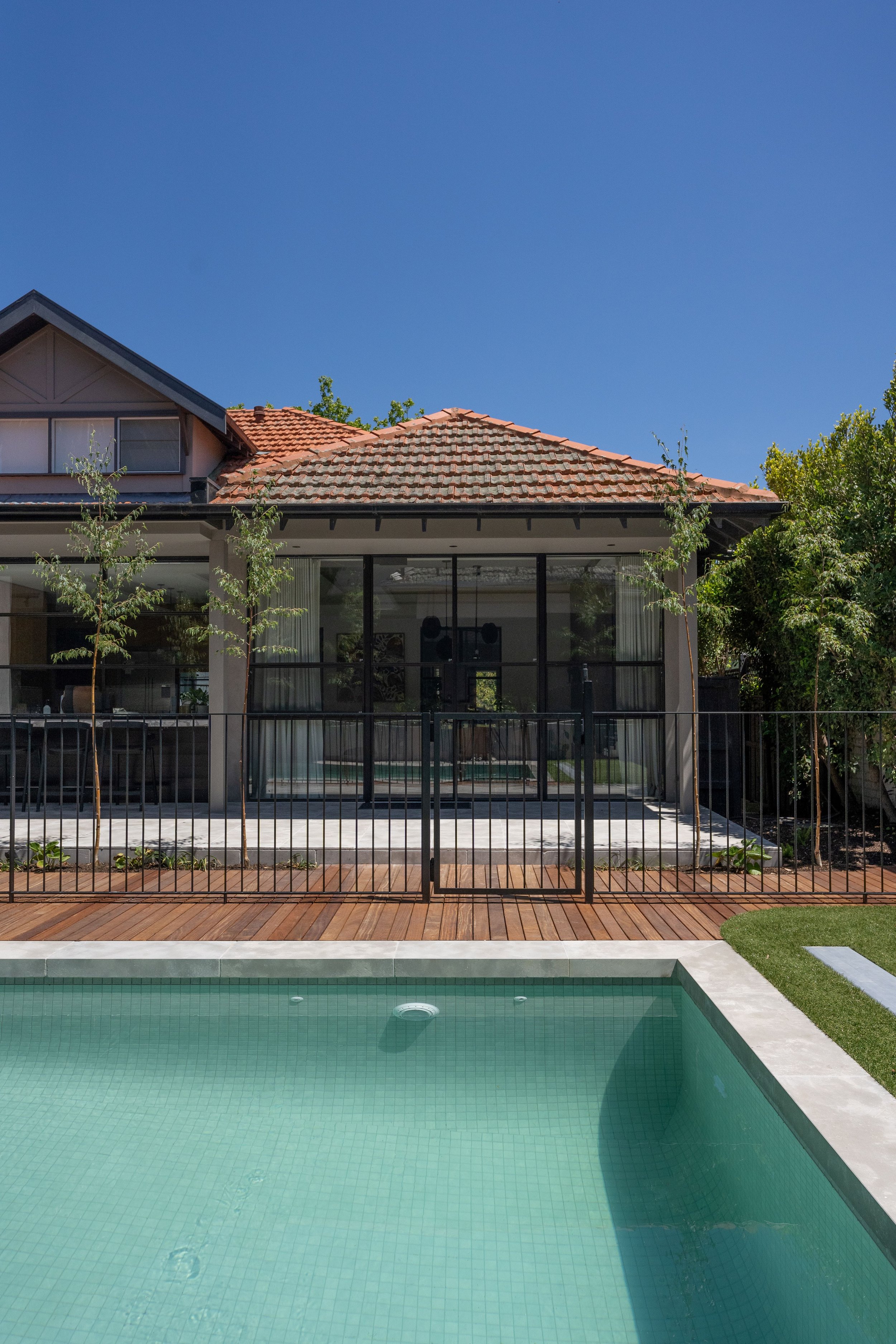 swimming pool and modern metal pool fence