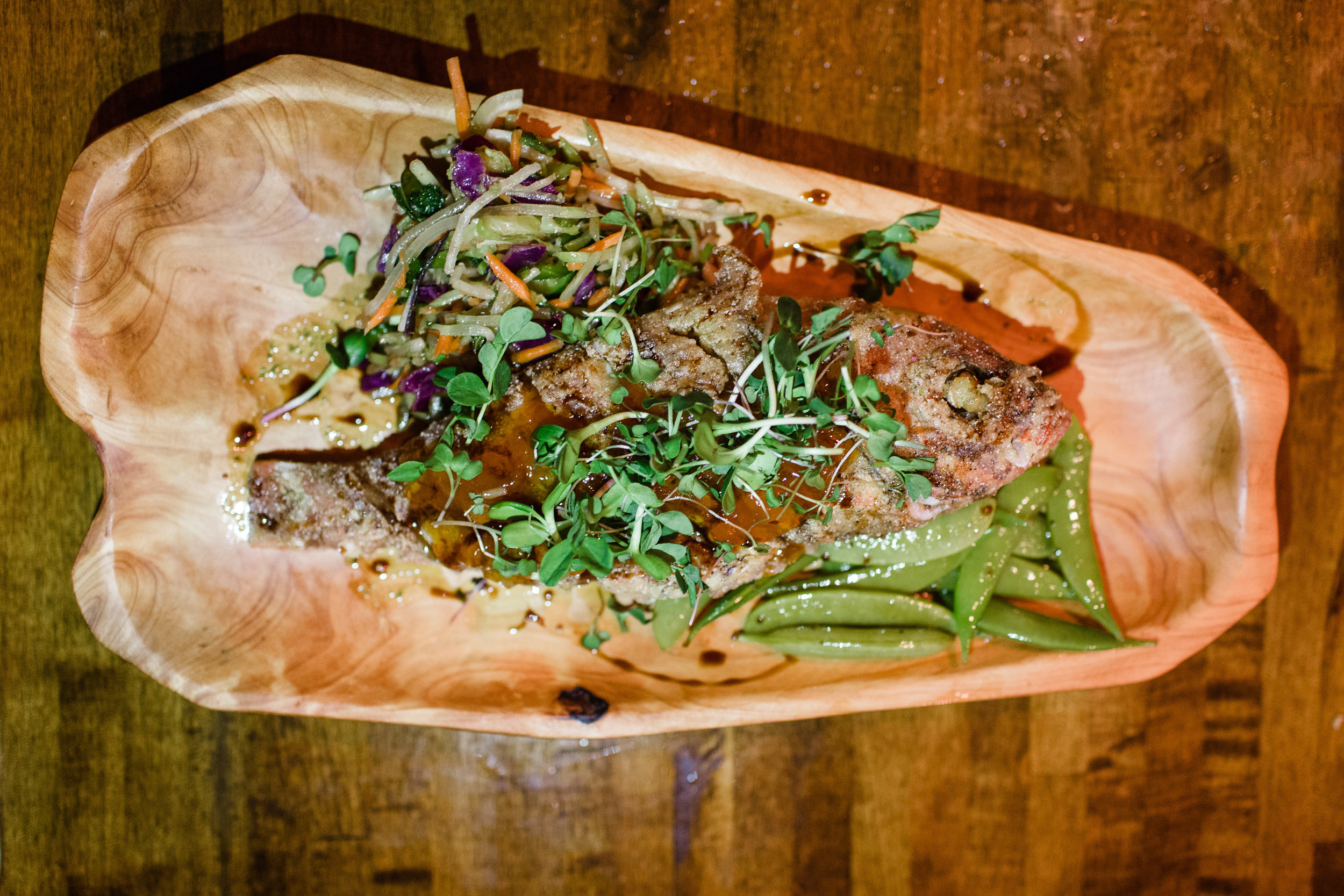 whole red snapper, sugar snap peas, thai marinated slaw + apricot glaze