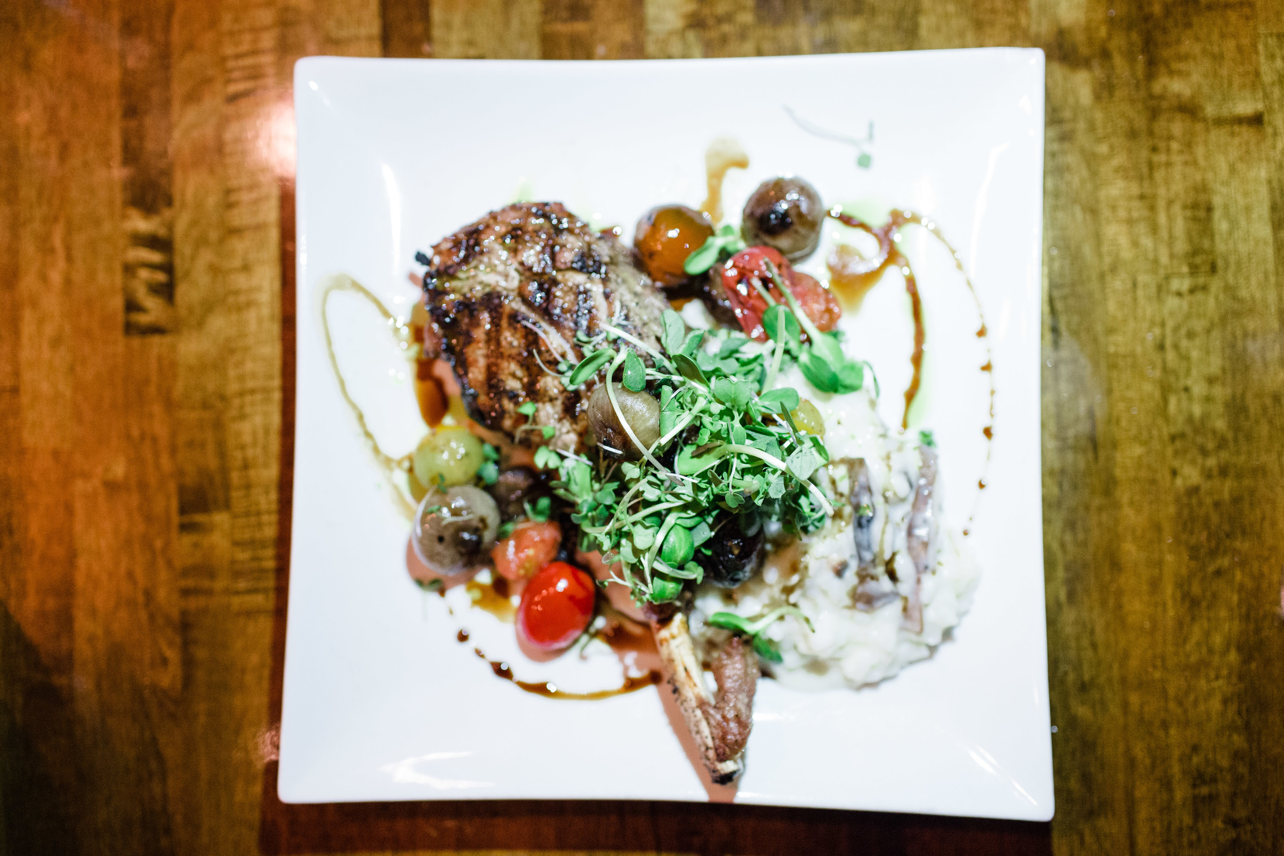 free range veal chop, creamy polenta + grilled cipollini onion + tomato