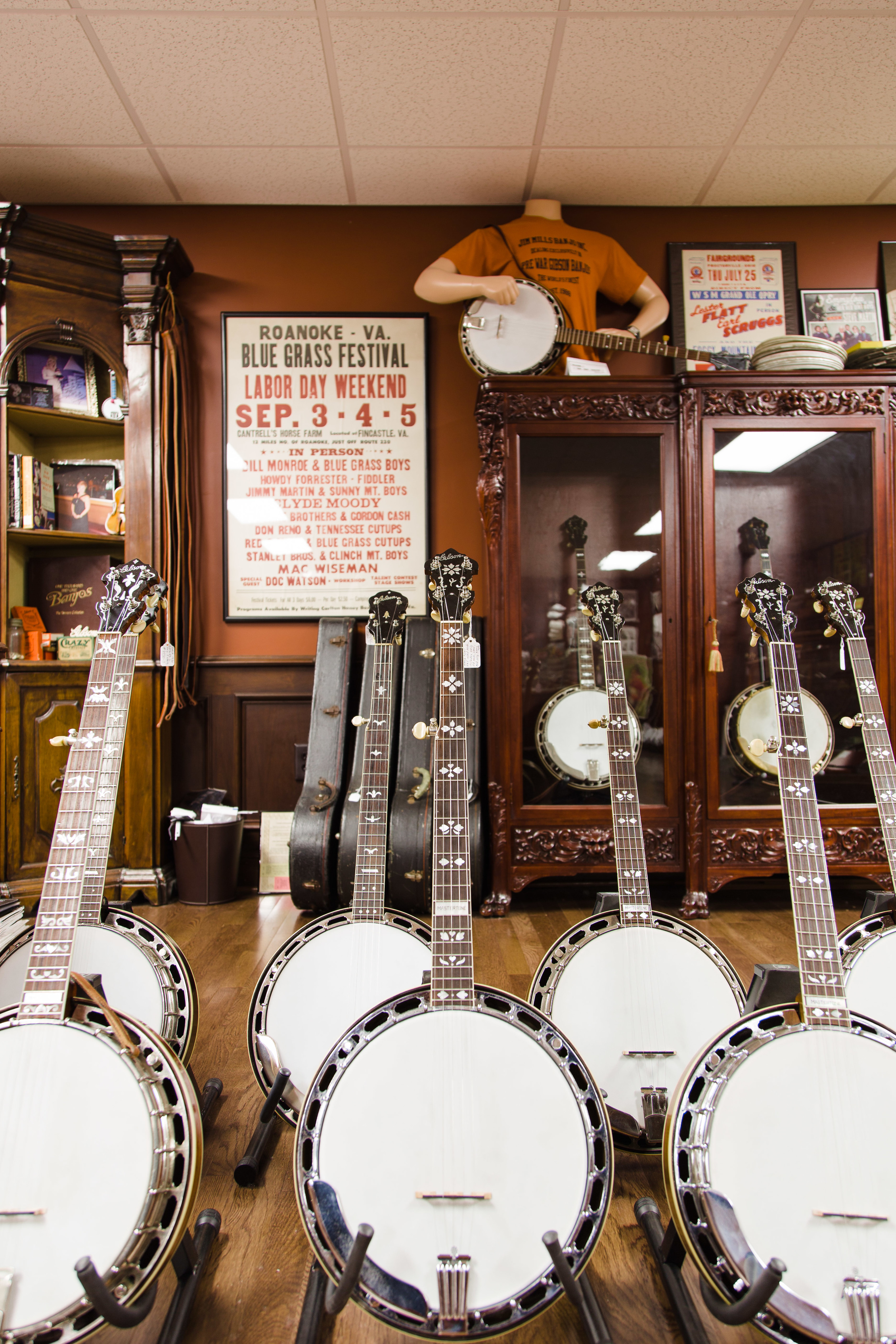 Seven of Mills' banjos waiting to find new homes.